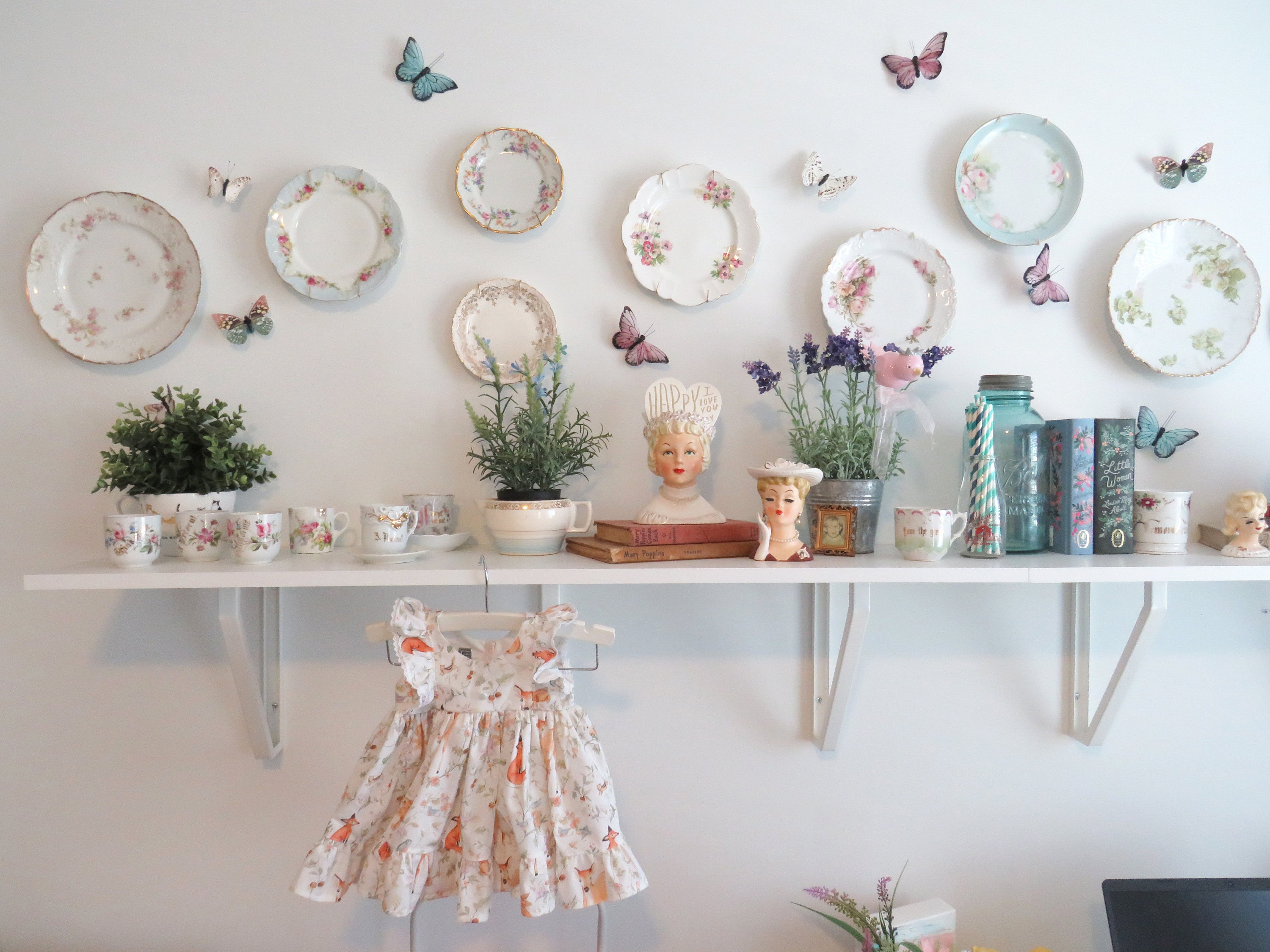 Wall decor with butterflies and baby dress