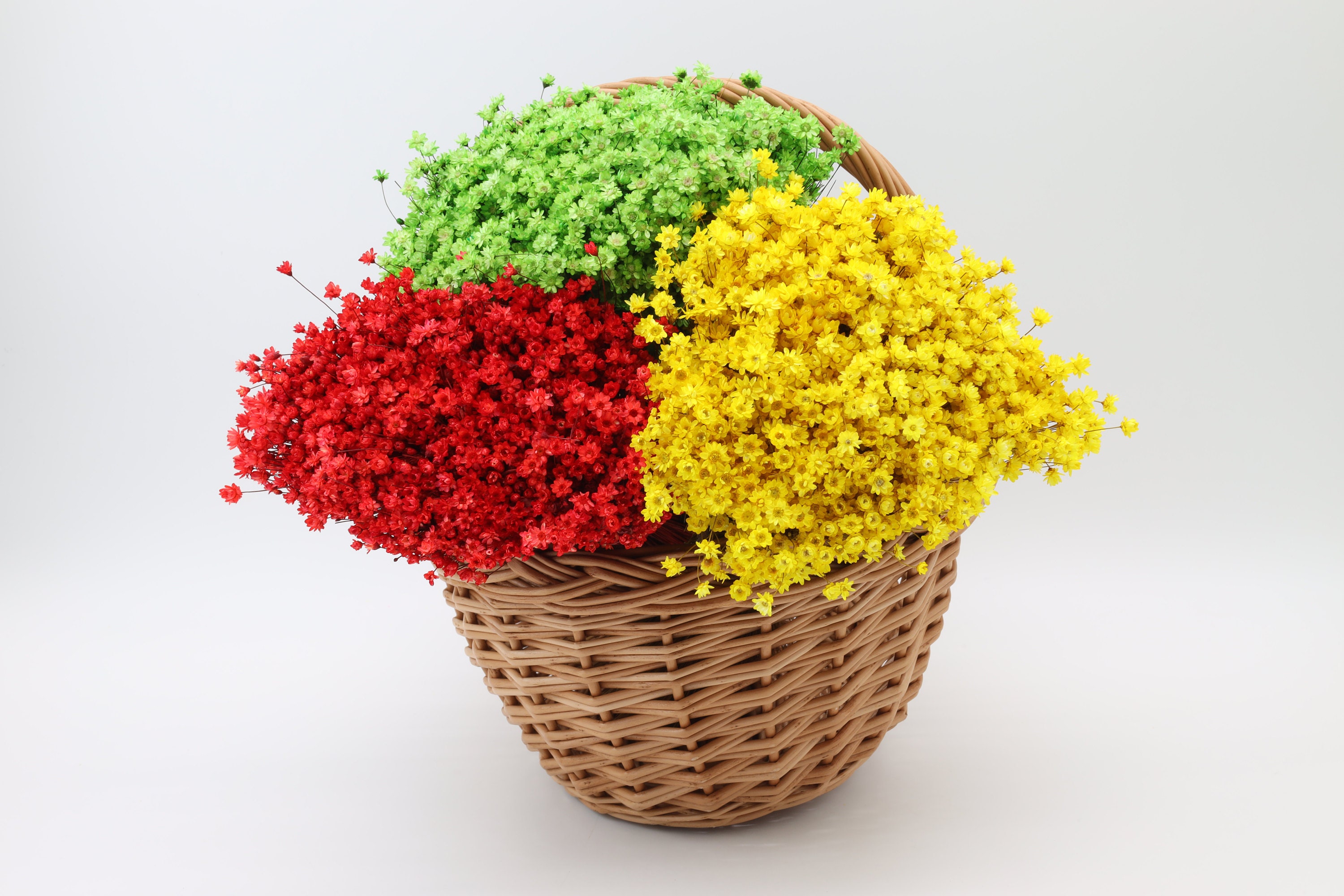 red glixia, green dried flowers, yellow glixia bouquete, wicker basket