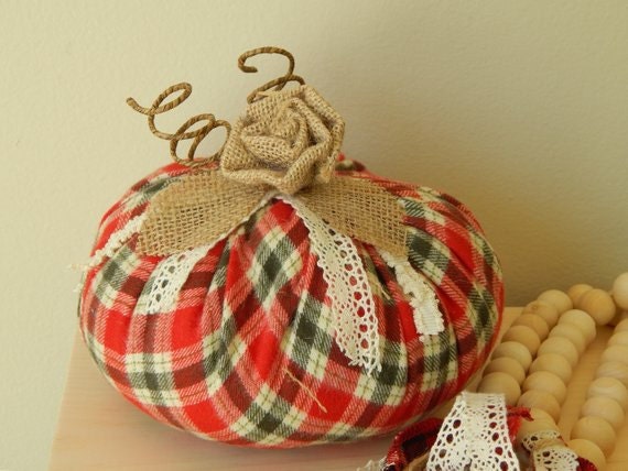 Flannel fabric pumpkin with cotton stems.