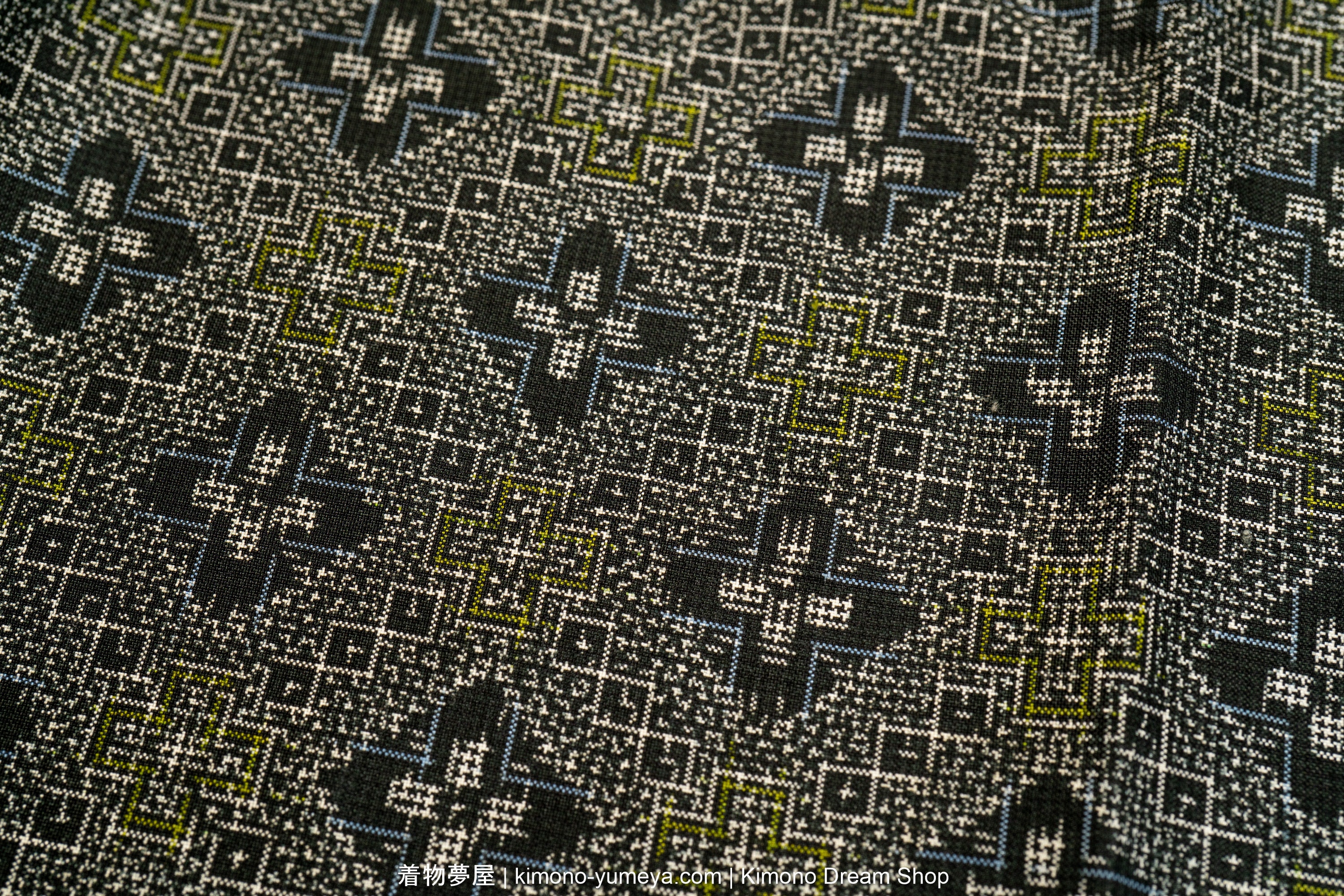 Geometric hishi pattern woven in Oshima tsumugi style.