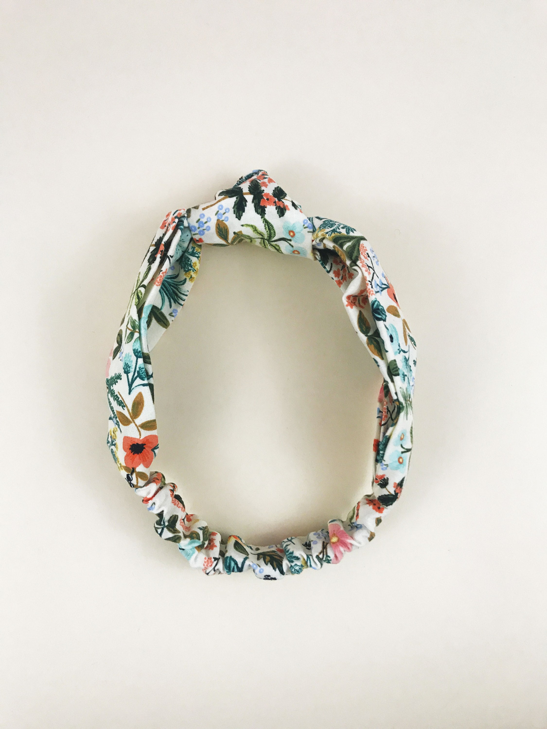 Cream floral knotted headbands.