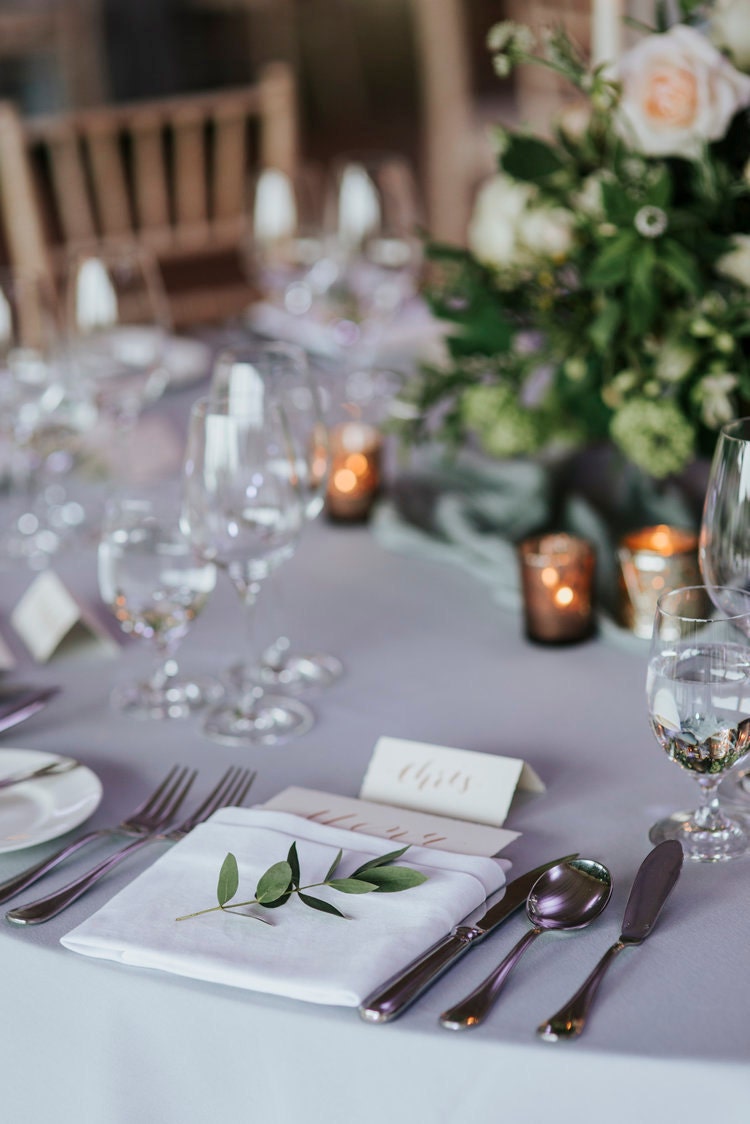 Wedding stationery with rose gold calligraphy placecard names