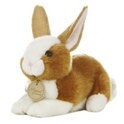 brown and white stuffed bunny with gold tag