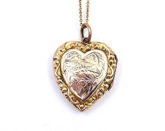 Victorian rose and yellow gold locket with a stamp for 9 carat back and front.