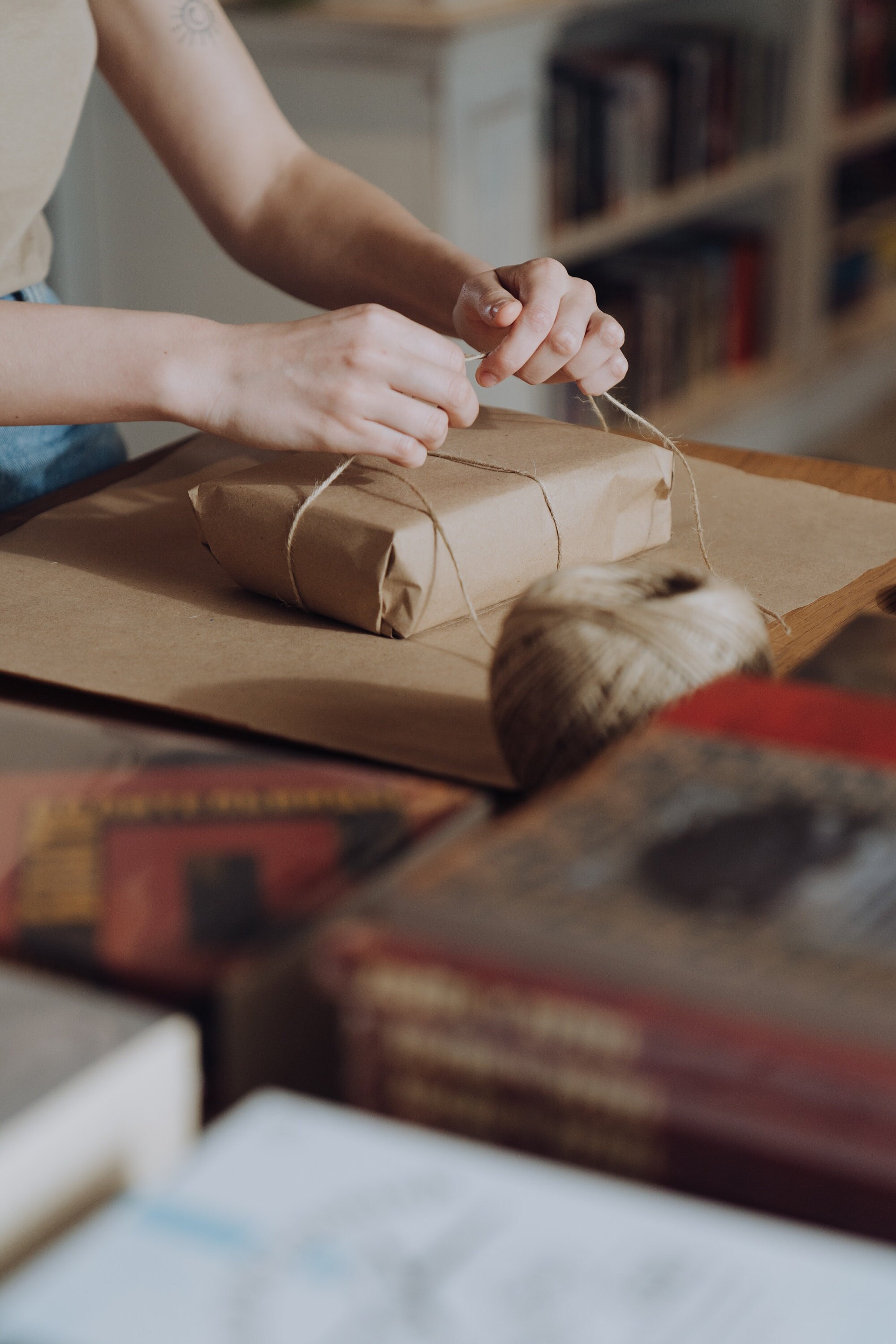 Photo by cottonbro studio: https://www.pexels.com/photo/person-holding-brown-yarn-on-brown-wooden-table-4865721/