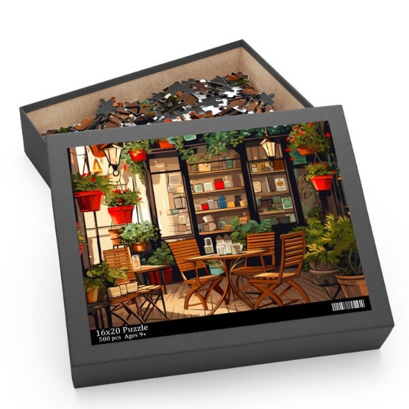 A 16x20 puzzle box showing an illustration of a cozy garden café surrounded by lush plants and flowers in hanging pots. The puzzle box contains 500 pieces and is labeled with “16x20 Puzzle” and “Ages 9+”.