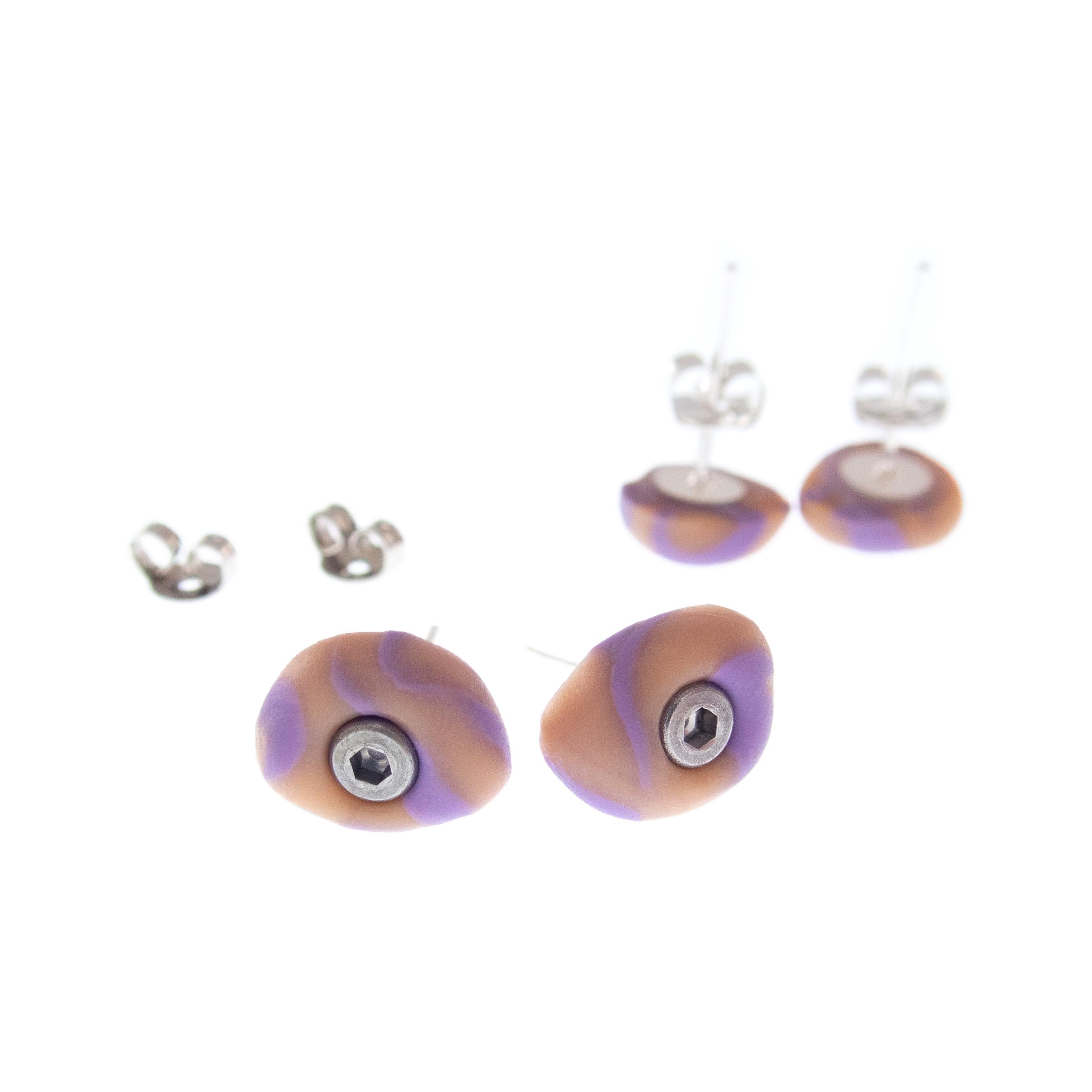 Climbing hold stud earrings featuring tiny crimp grips inspired by indoor bouldering walls