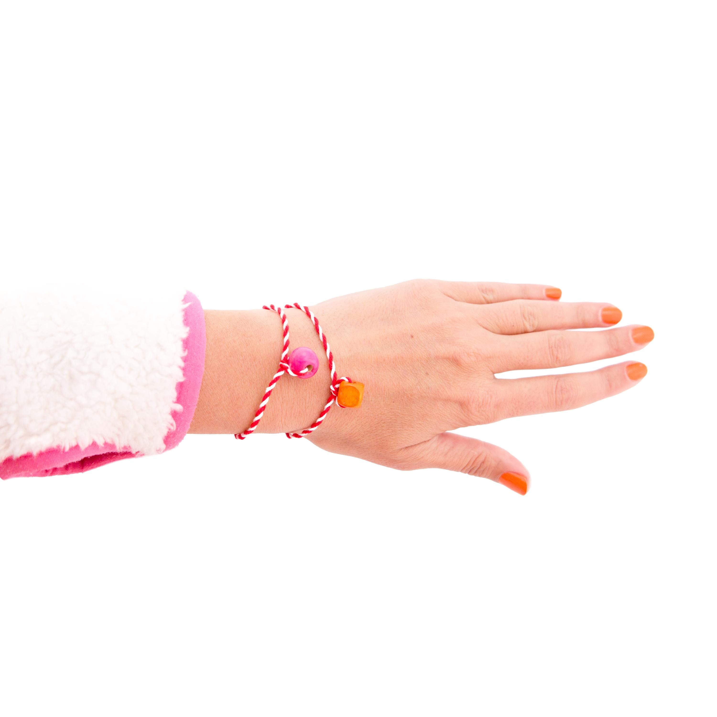 Handcrafted Martenica bracelets Nadamlada in red and white cotton thread with decorative wooden beads
