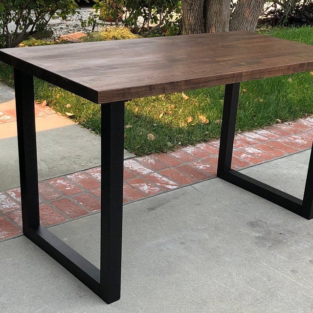 Wider table legs offer a grounded look