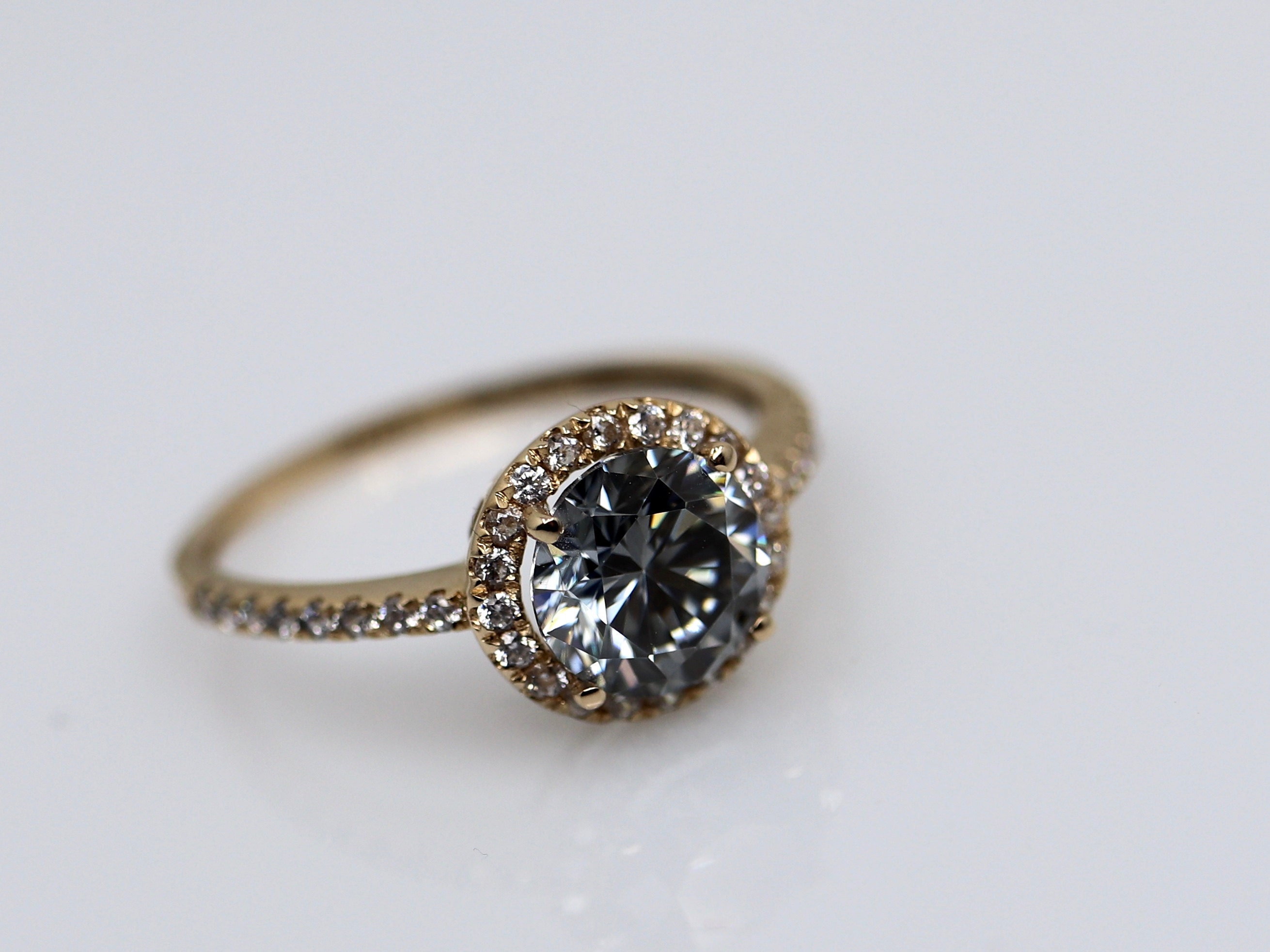 This moissanite turned out to be light blue. This actual ring.