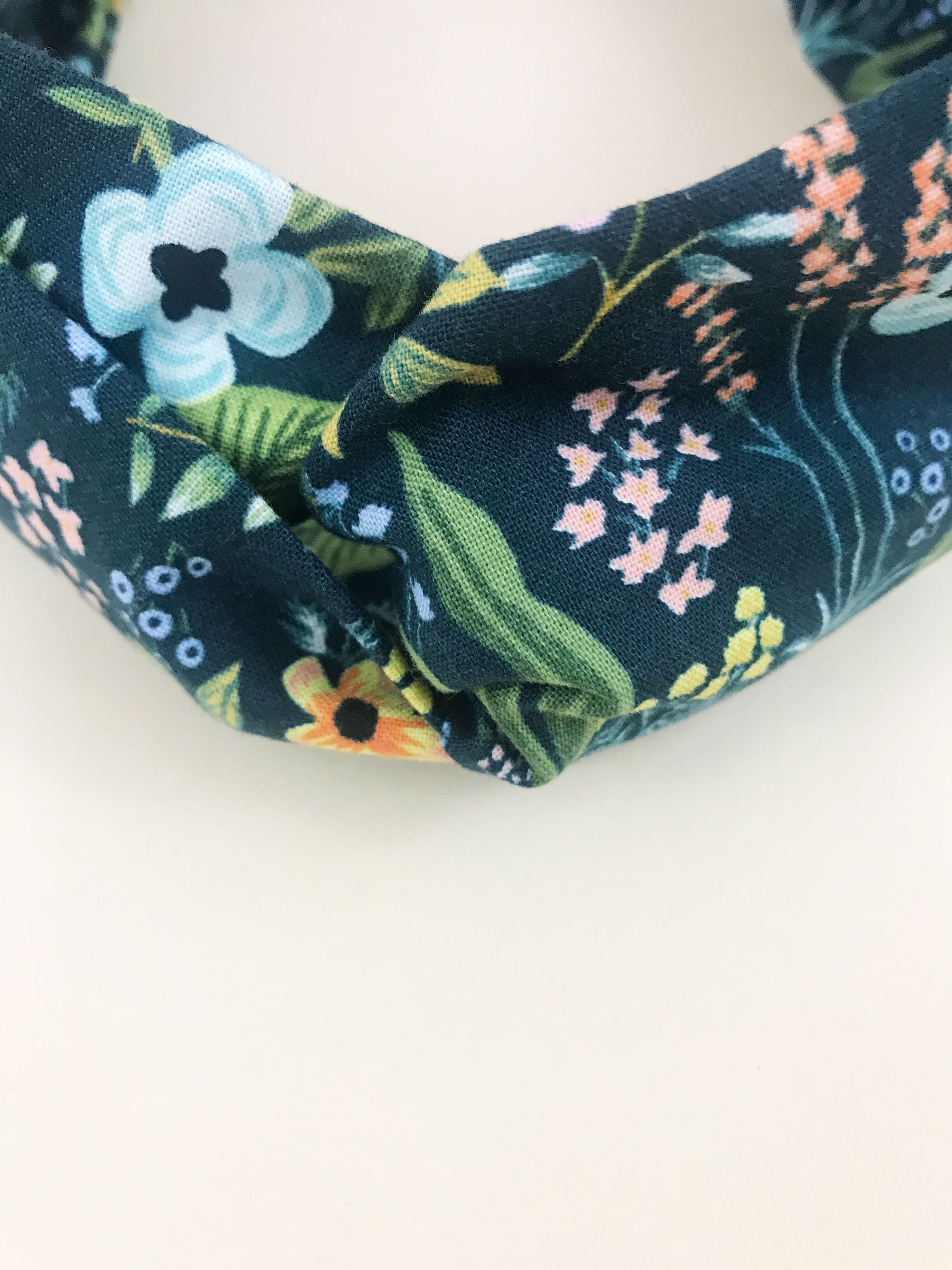 Navy blue floral twisted headbands.