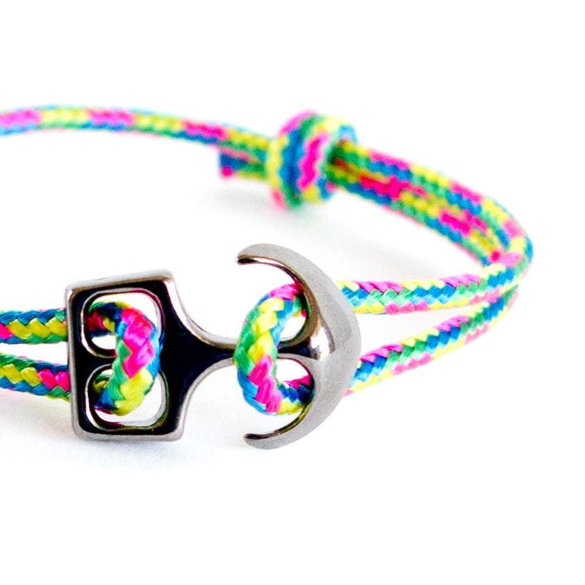 Close-up of a rainbow rope anchor bracelet featuring a polished metal anchor charm, minimalist unisex design by Nadamlada.