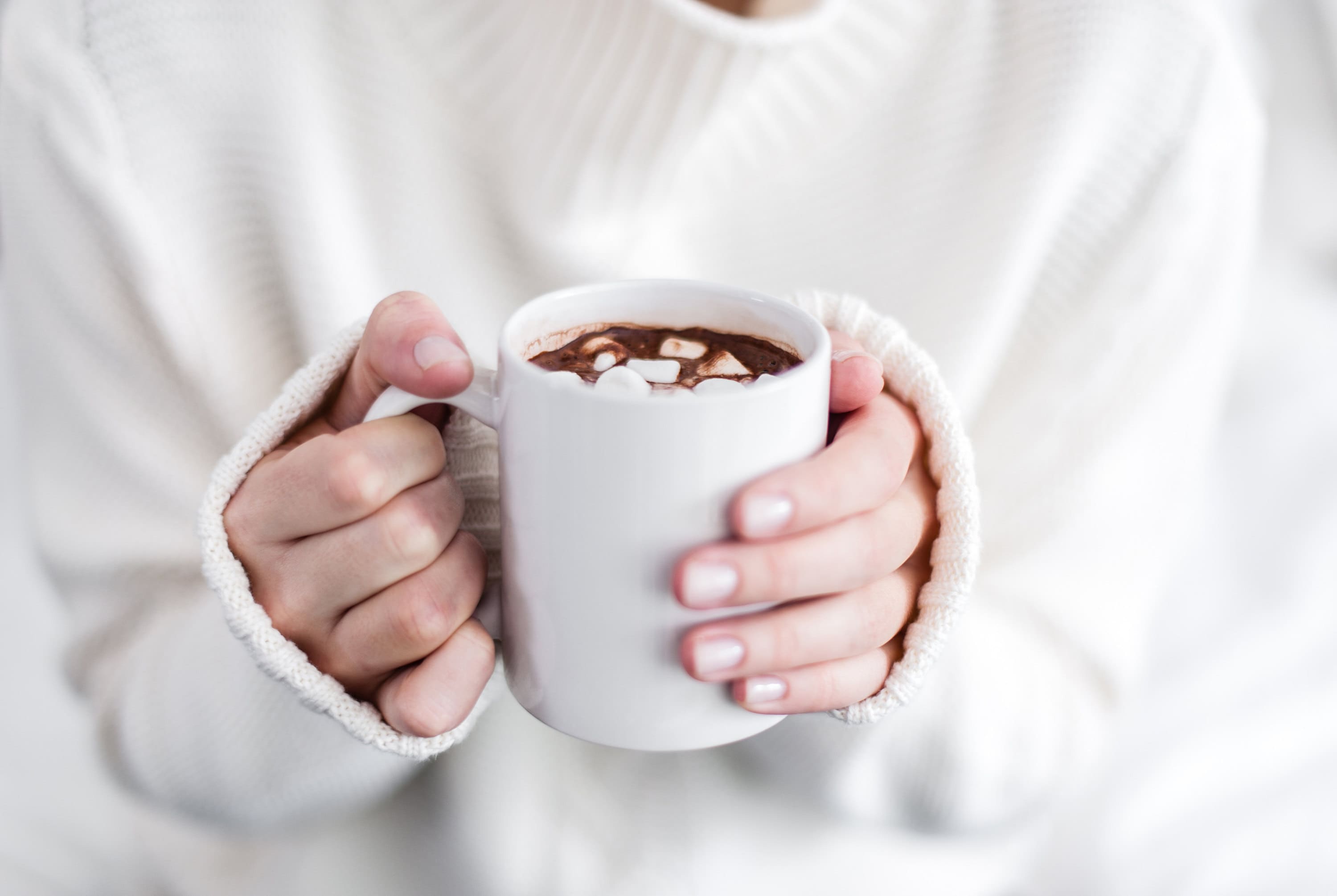 mug of cocoa to plan a baby shower