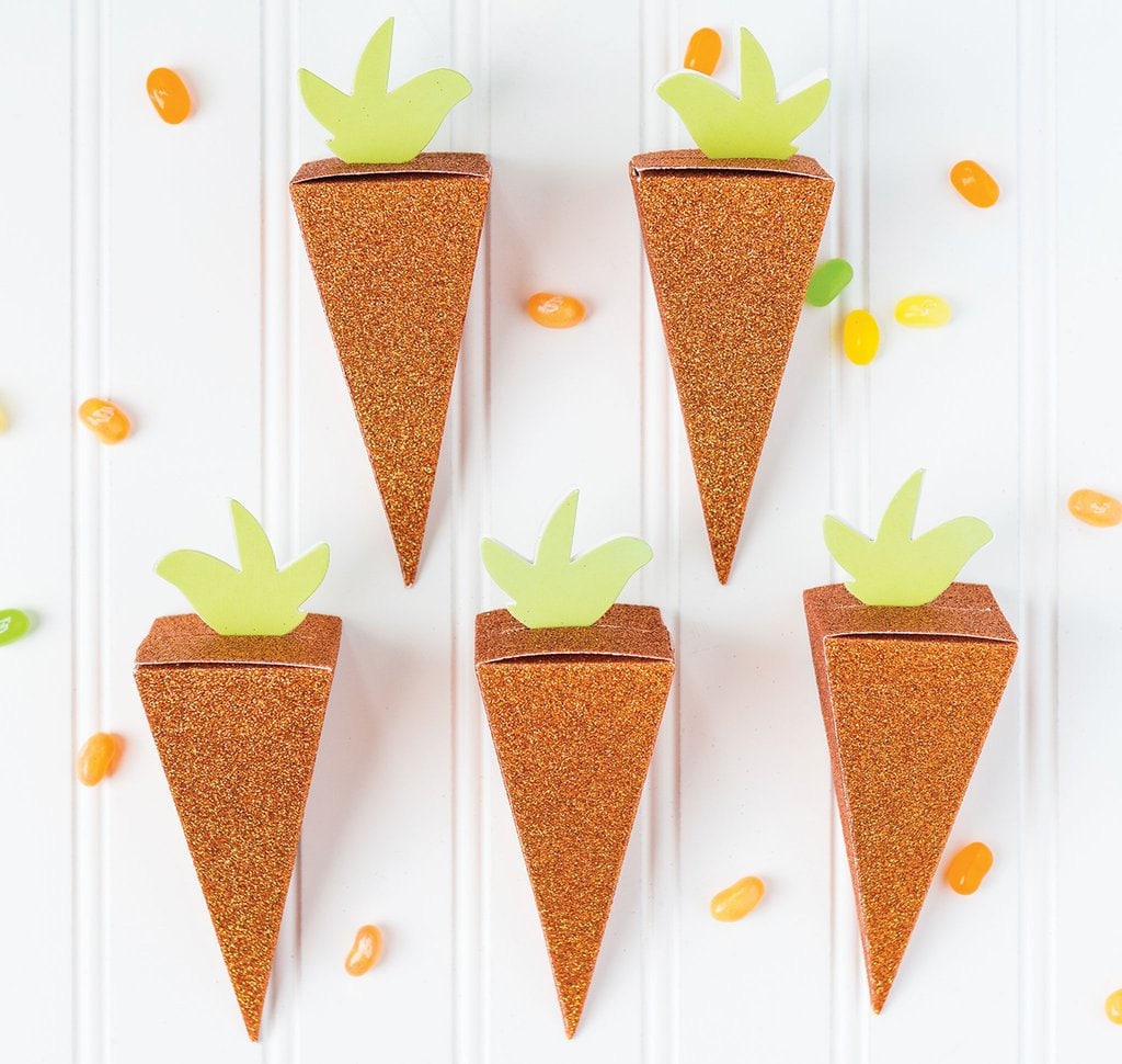 orange paper party favor boxes folded as carrots for Easter party