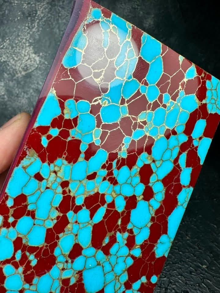 “Red and turquoise hybrid synthetic gemstone slab with gold veins by Mohit Impacts, strong contrast collector-grade material for high-end crafts.”