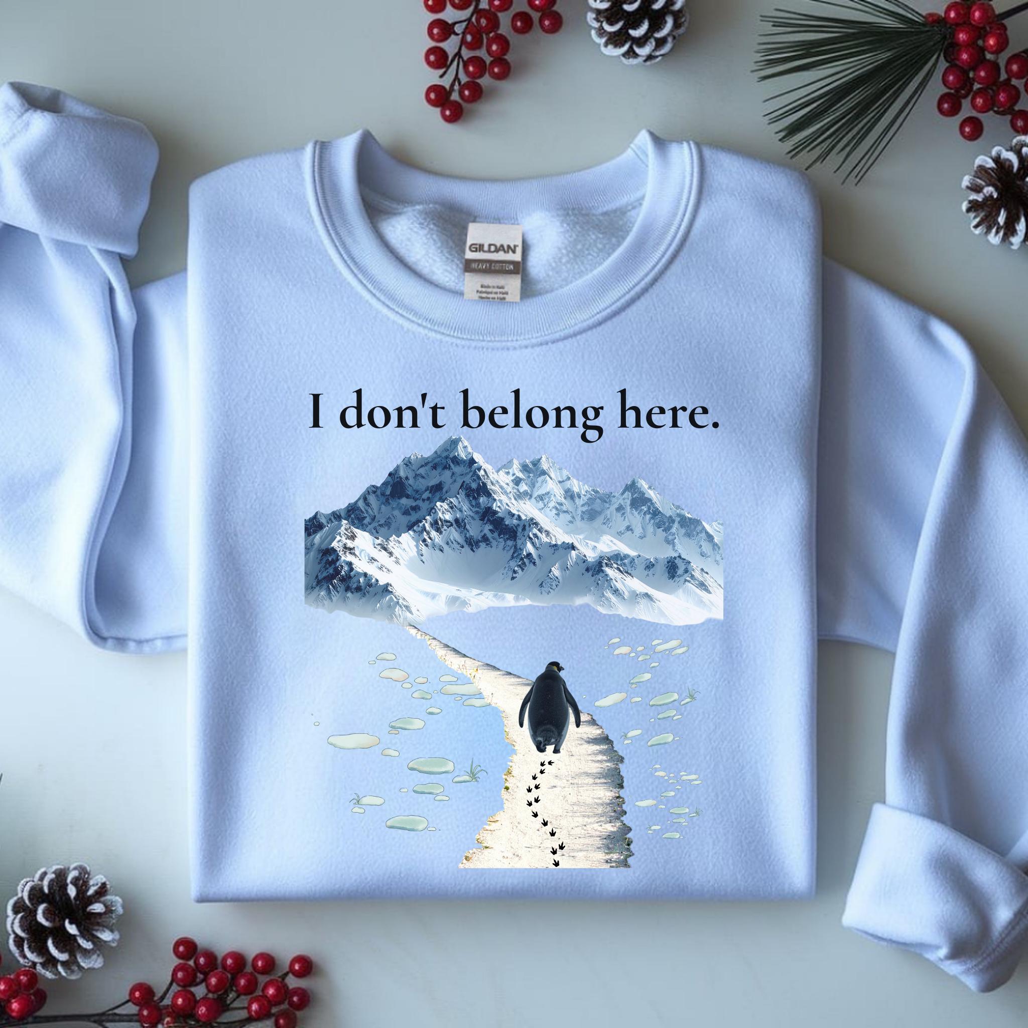 Penguin walking alone away from group with i dont belong here text