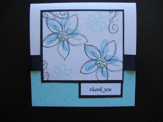light blue card with black ribbon flowers and thank you