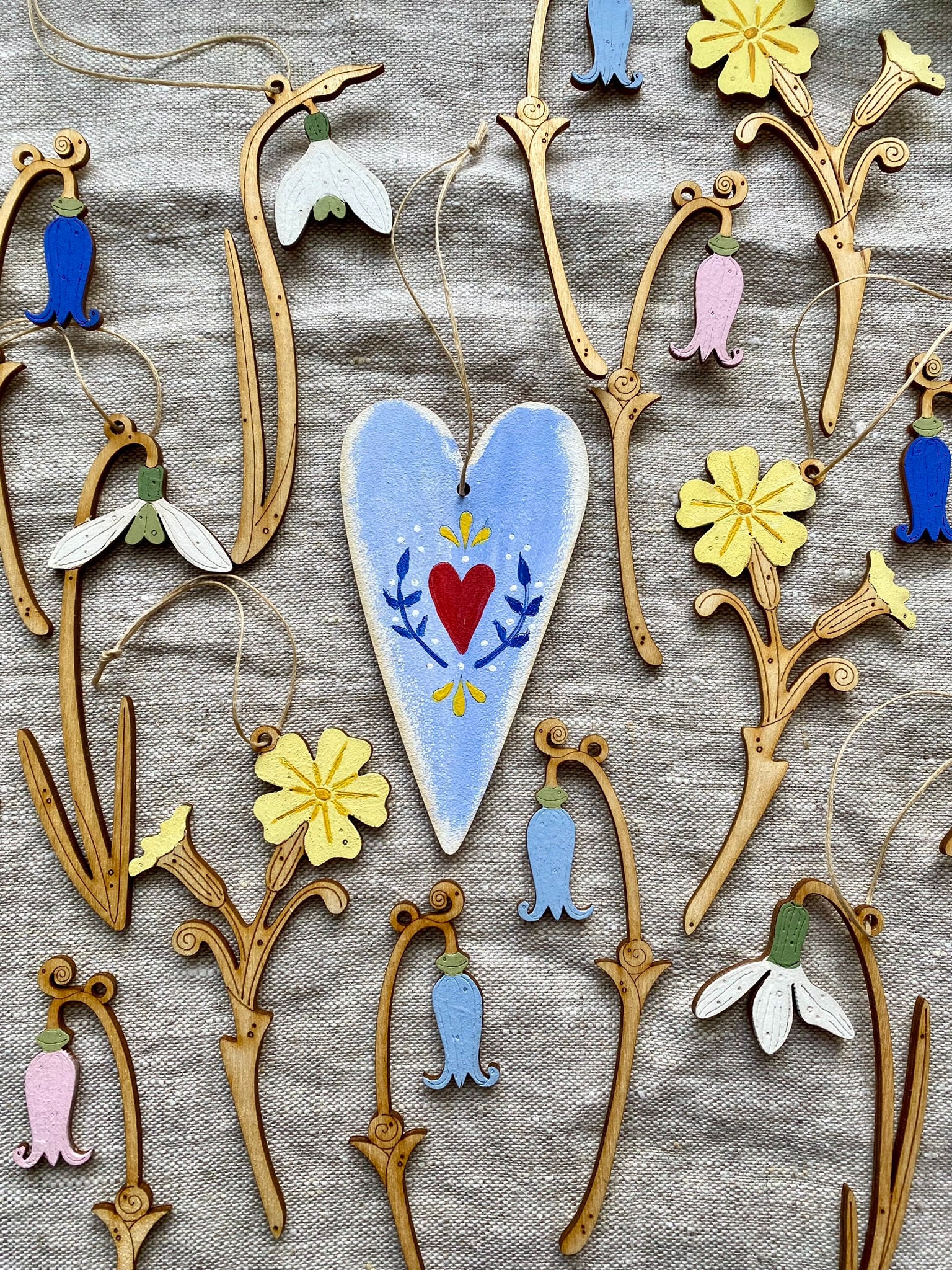 A Hand Painted Wooden Heart and Spring Flower Decorations