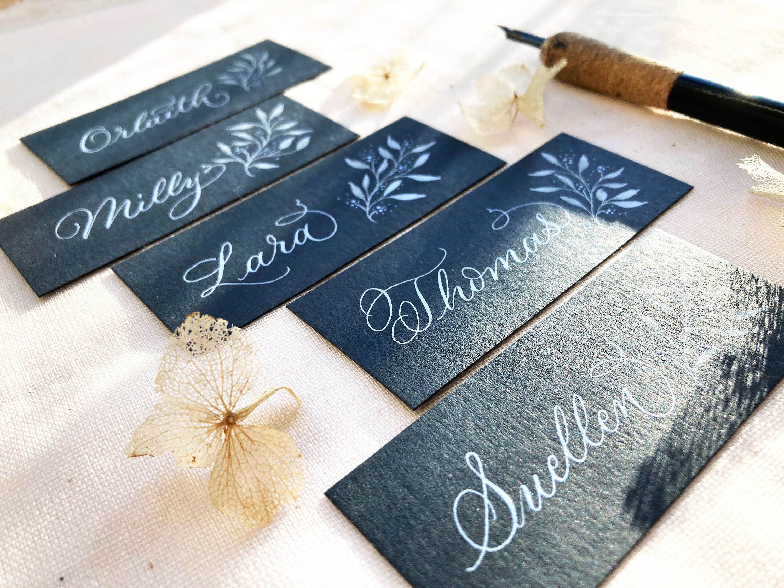 Slate coloured wedding name settings by a calligrapher in the UK