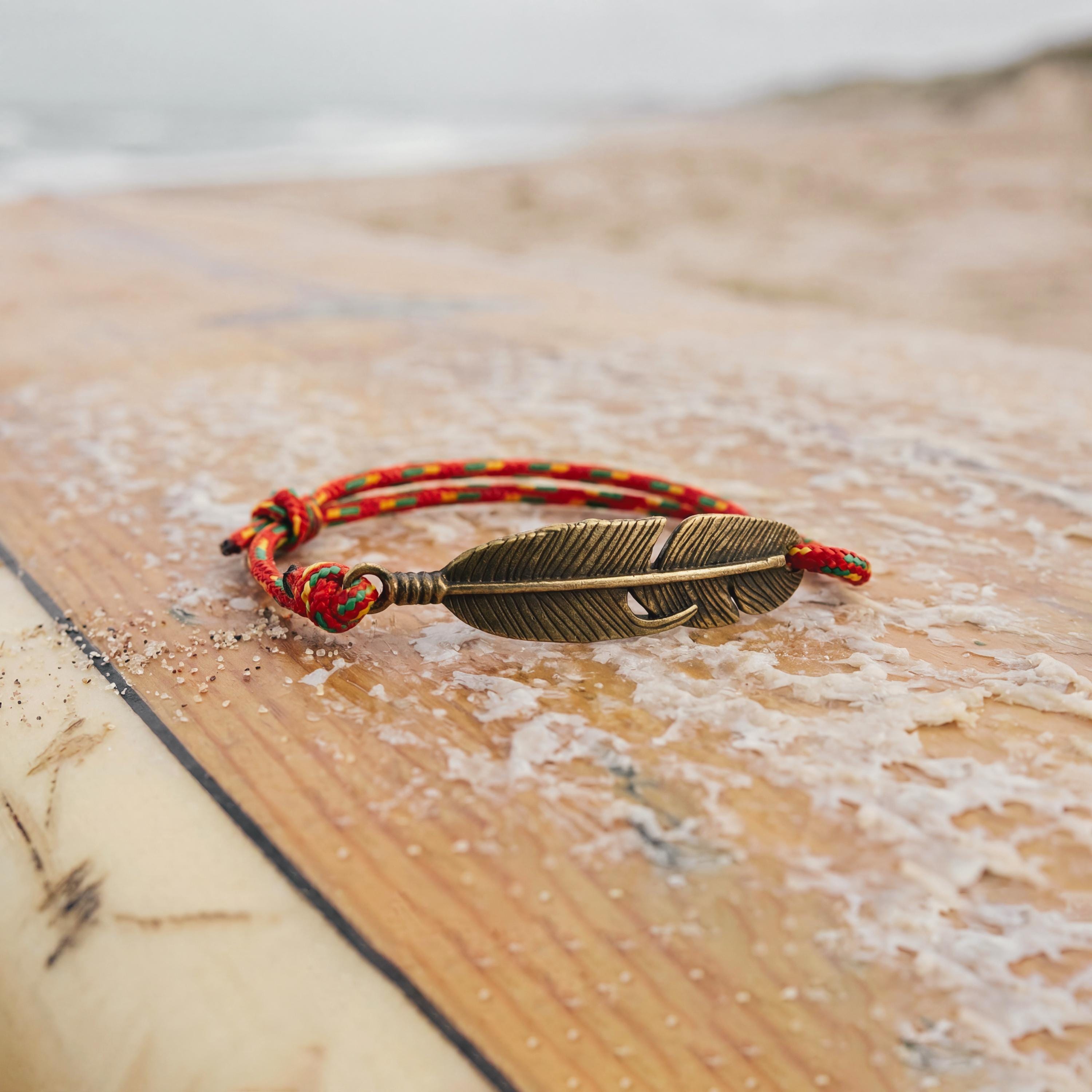 Handmade adjustable rope bracelet crafted from durable climbing-inspired cord with feather charm, minimalist unisex jewelry inspired by outdoor adventure and climbing rope design.