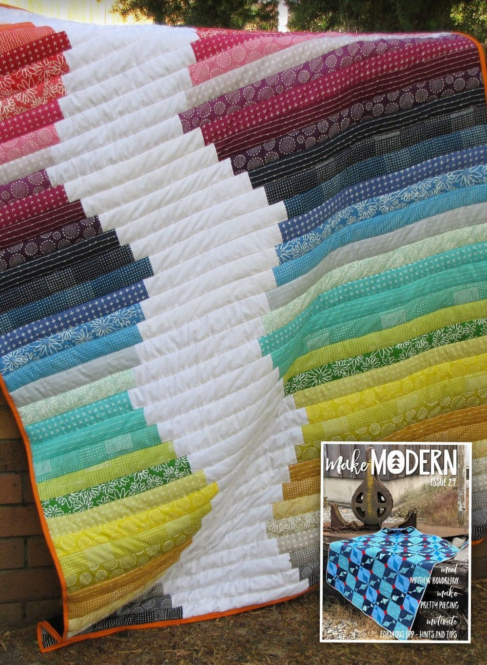 Picture of a quilt draped over a wall. First published by Make Modern Quilting Magazine.