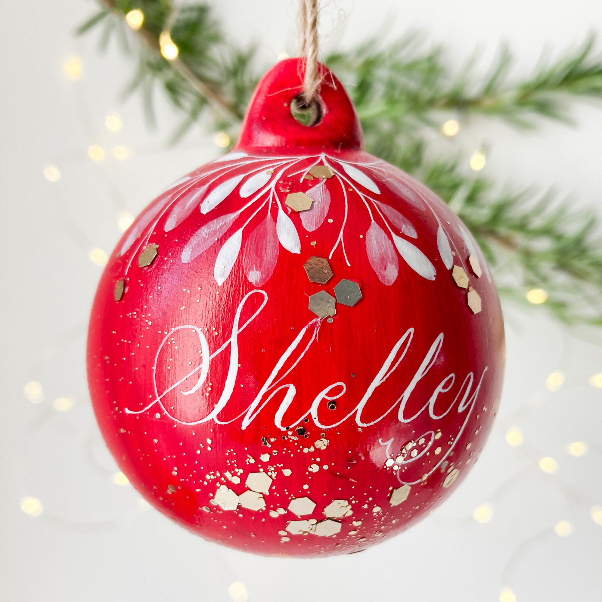Hand written calligraphy personalised Christmas name bauble - red with gold glitter