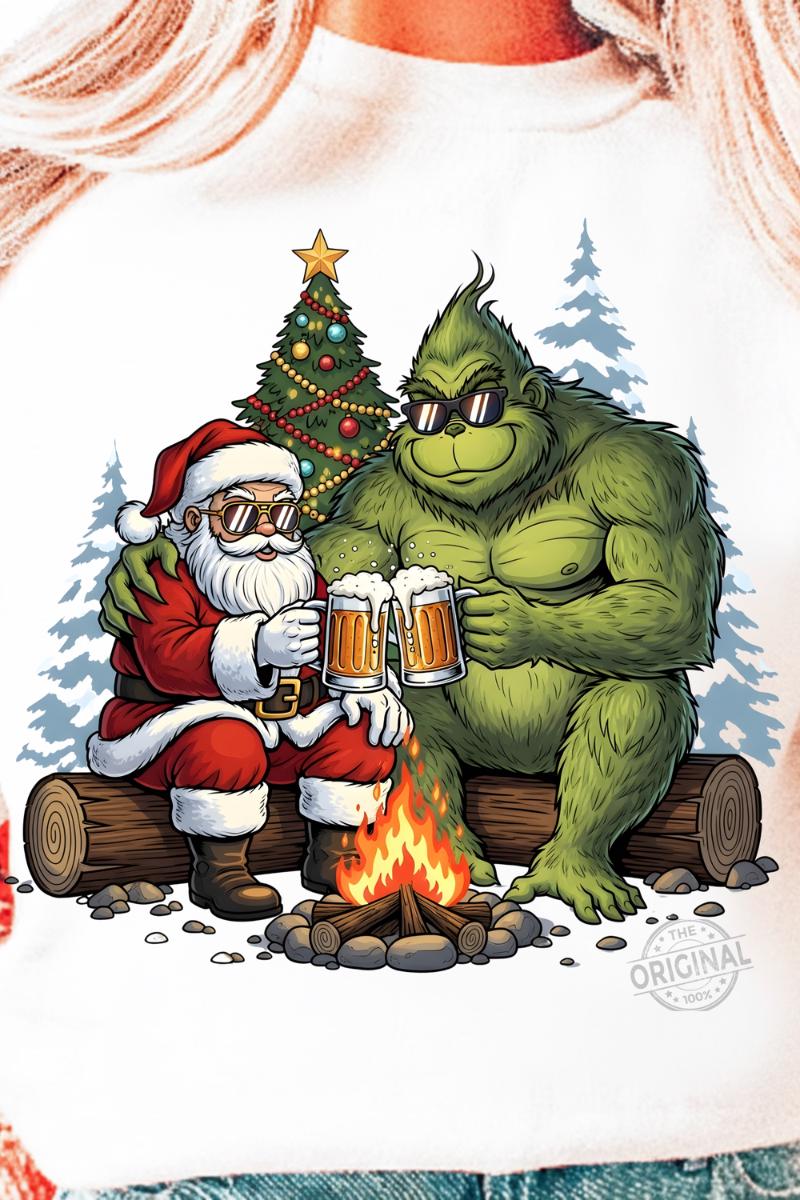 Funny Christmas design featuring the Grinch and Santa Claus sitting by a campfire, clinking mugs of beer, with a decorated Christmas tree and snowy background, perfect for holiday t-shirts and mugs