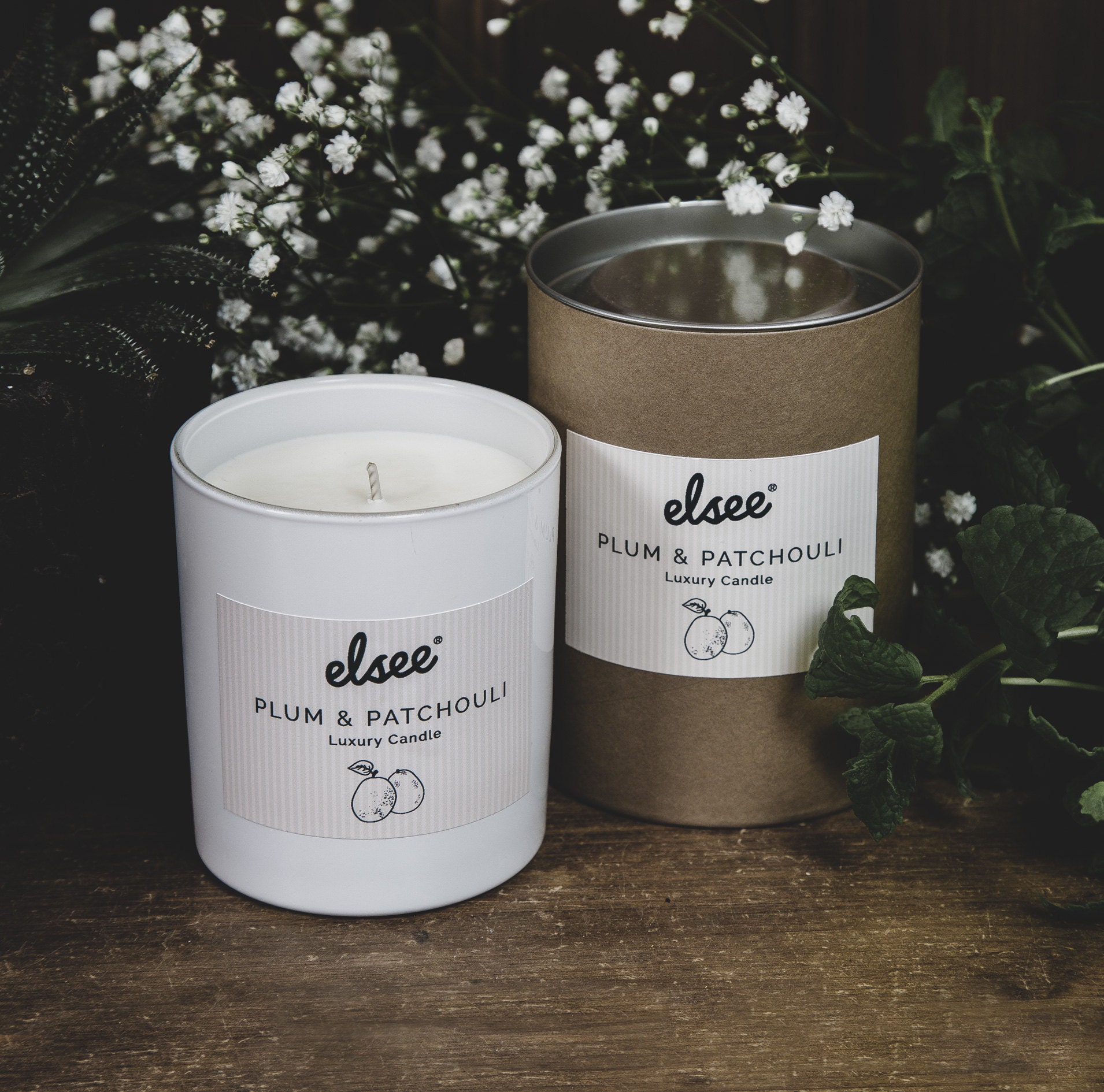 Candle in a glass container and rustic box