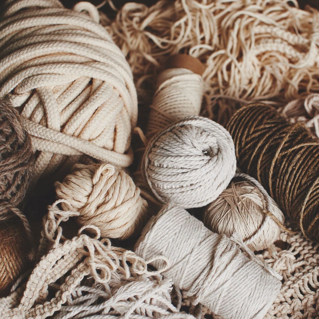 a bunch of different neutral coloured yarns in various textures by saigefyre
