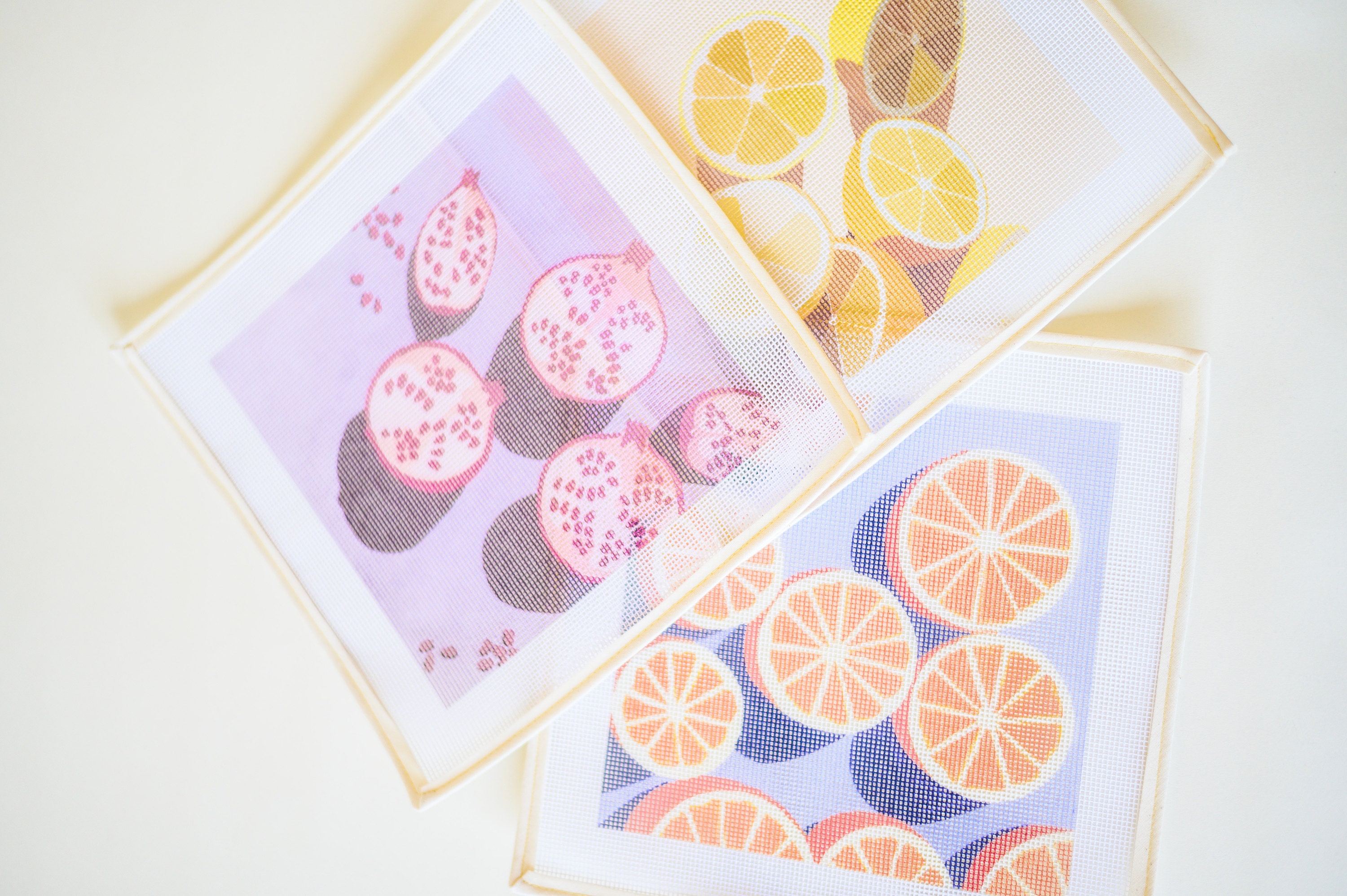 Pomegranates, Oranges and Lemons printed needlepoint canvases from Unwind Studio designed by Laura Croft, Ana Popescu and Anca Putin
