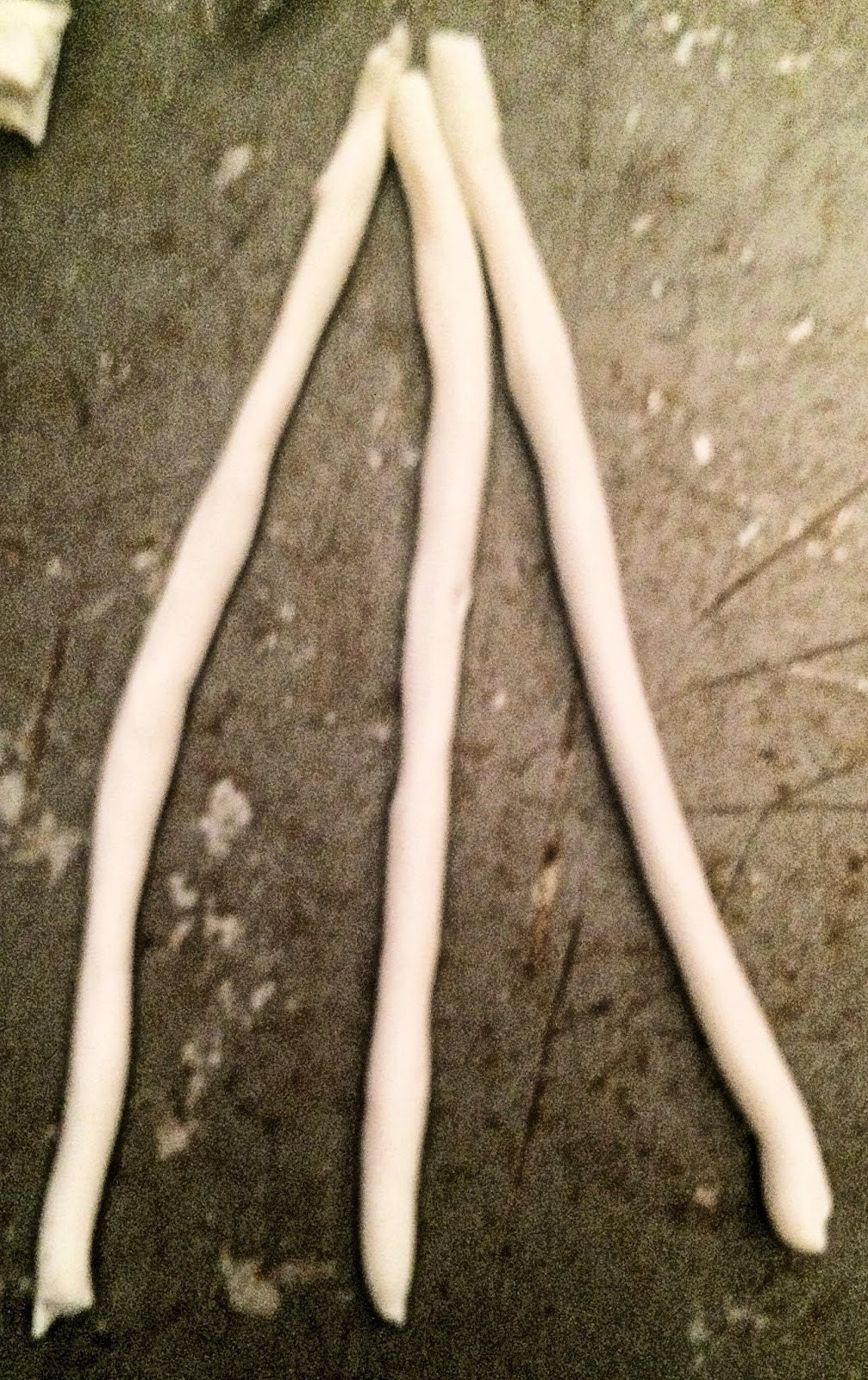 Three thin clay strips braided together
