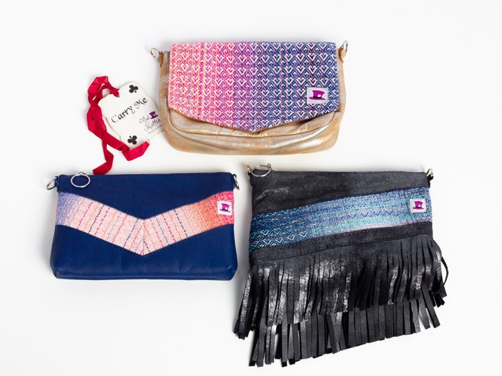 Three Mad Hatter Warped & Woven Handbags including a Carrie and two Hartleys. Carrie has gold foil leather and Hartleys have blue and silver foil leather.