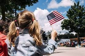Kids celebrating Independence Day of USA with flags