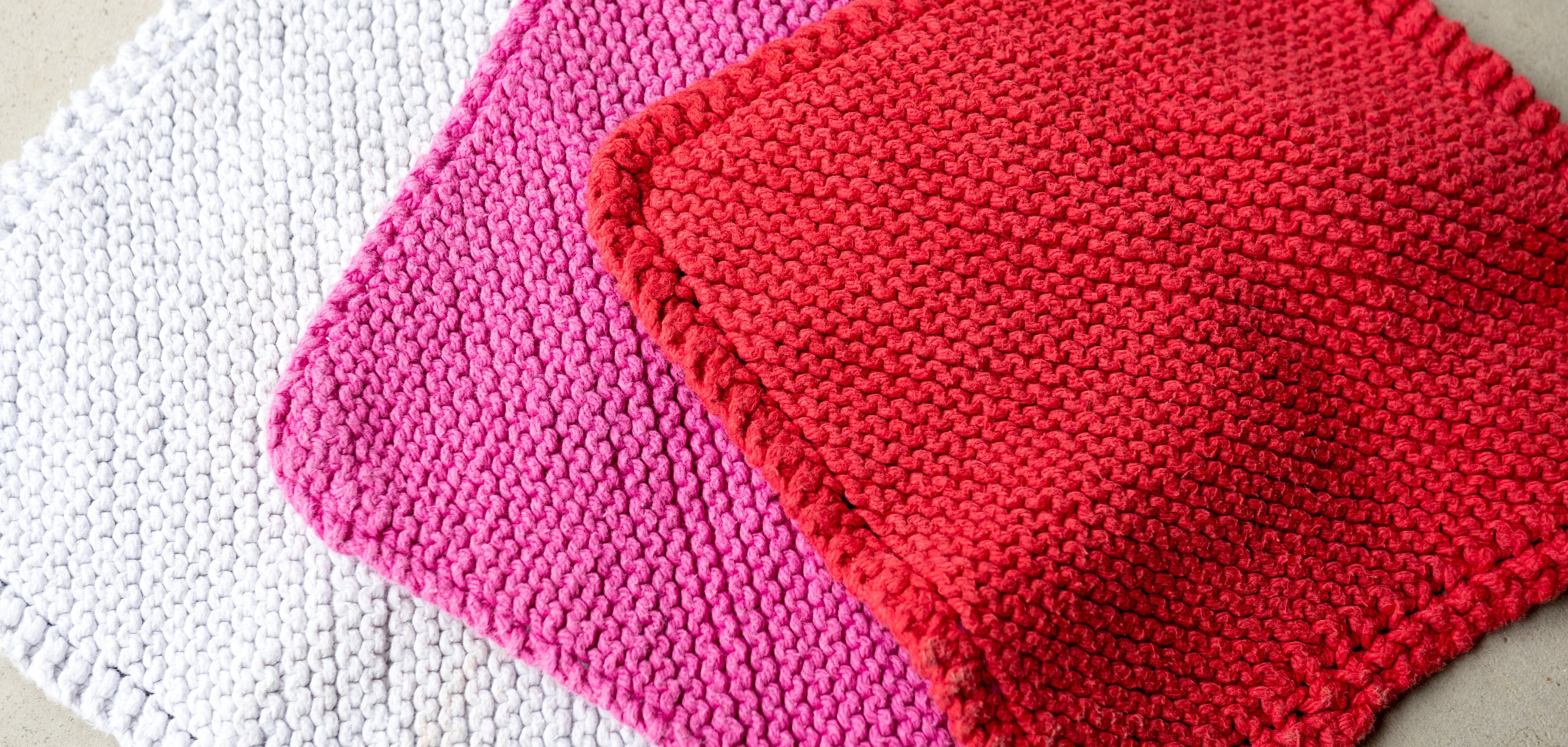White, pink, and red wash cloths that I have knitted over the years.