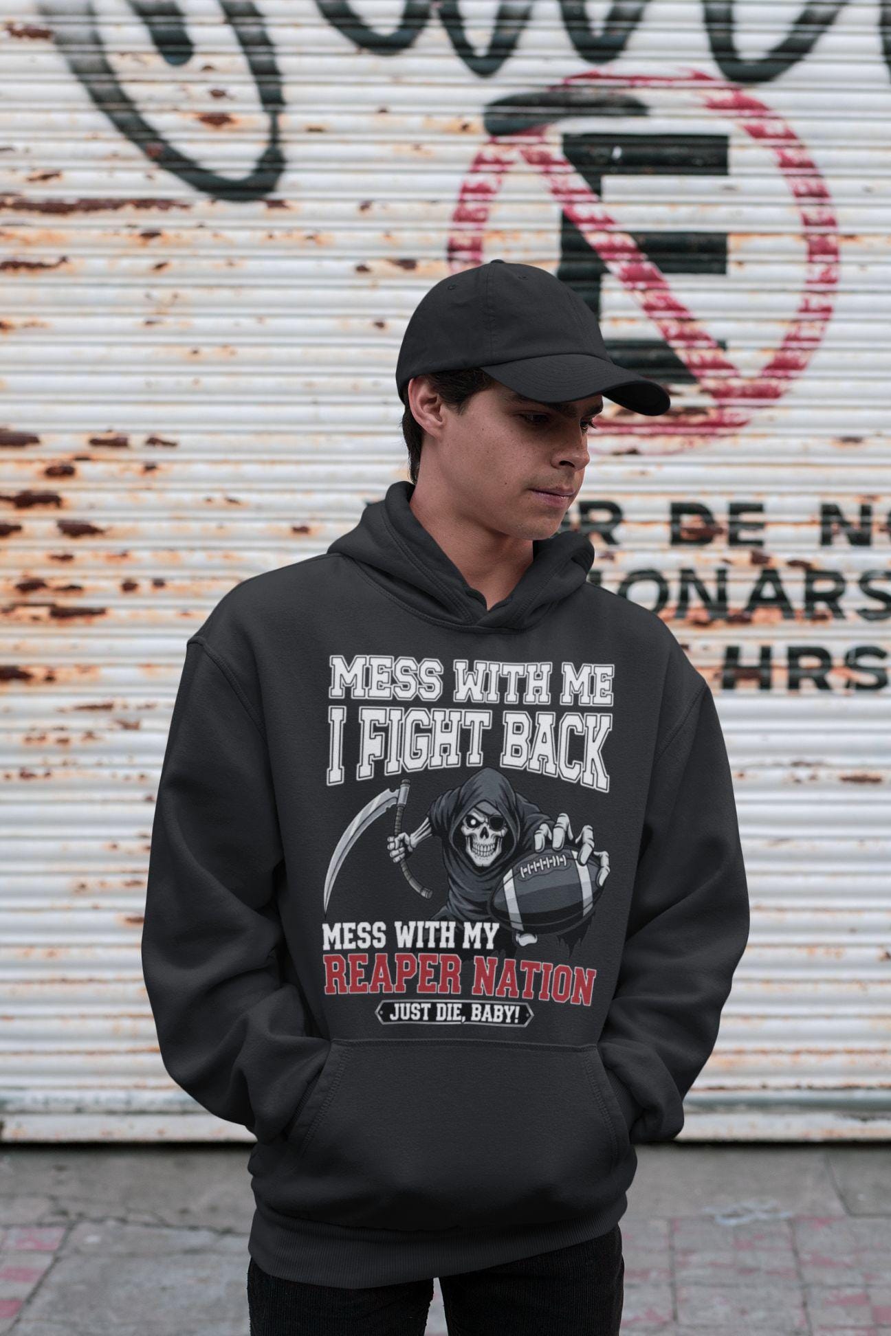 Man wearing the black Reaper Nation parody Raider Nation hoodie, featuring a grim reaper and Just Die, Baby! text.