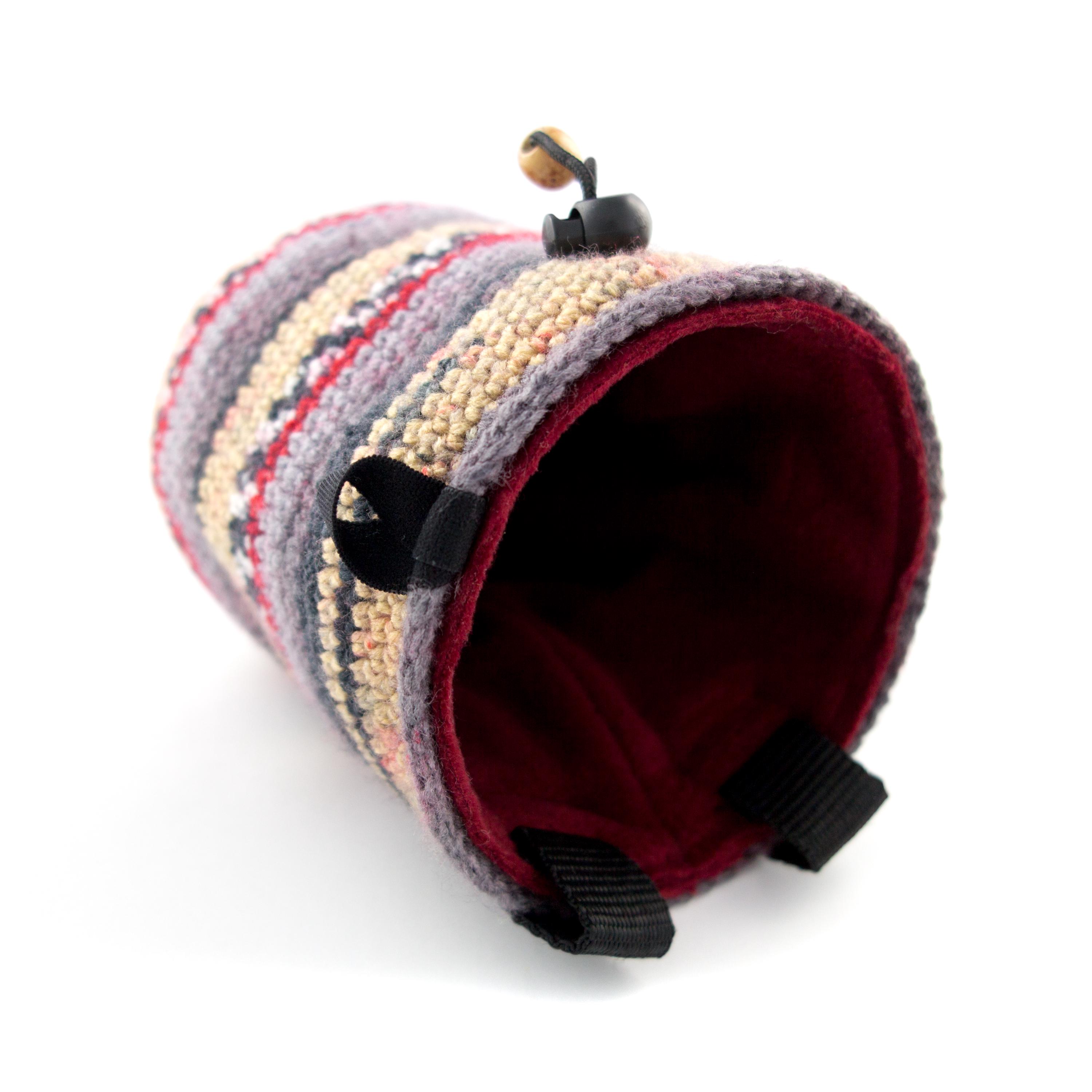 Nadamlada climbing chalk bag with handcrafted striped pattern, essential indoor climbing gear for training and bouldering.