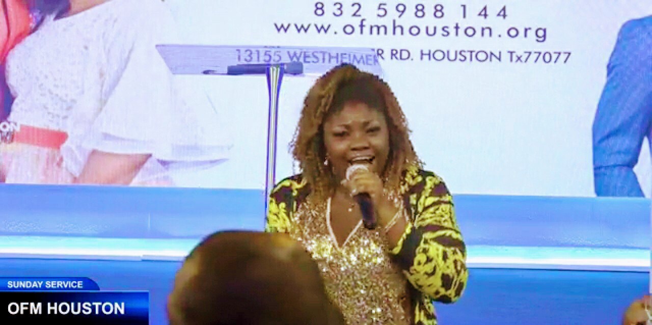 Picture of Rebeccah Worship leading Praise and Worship at Omega Fire Ministries Houston