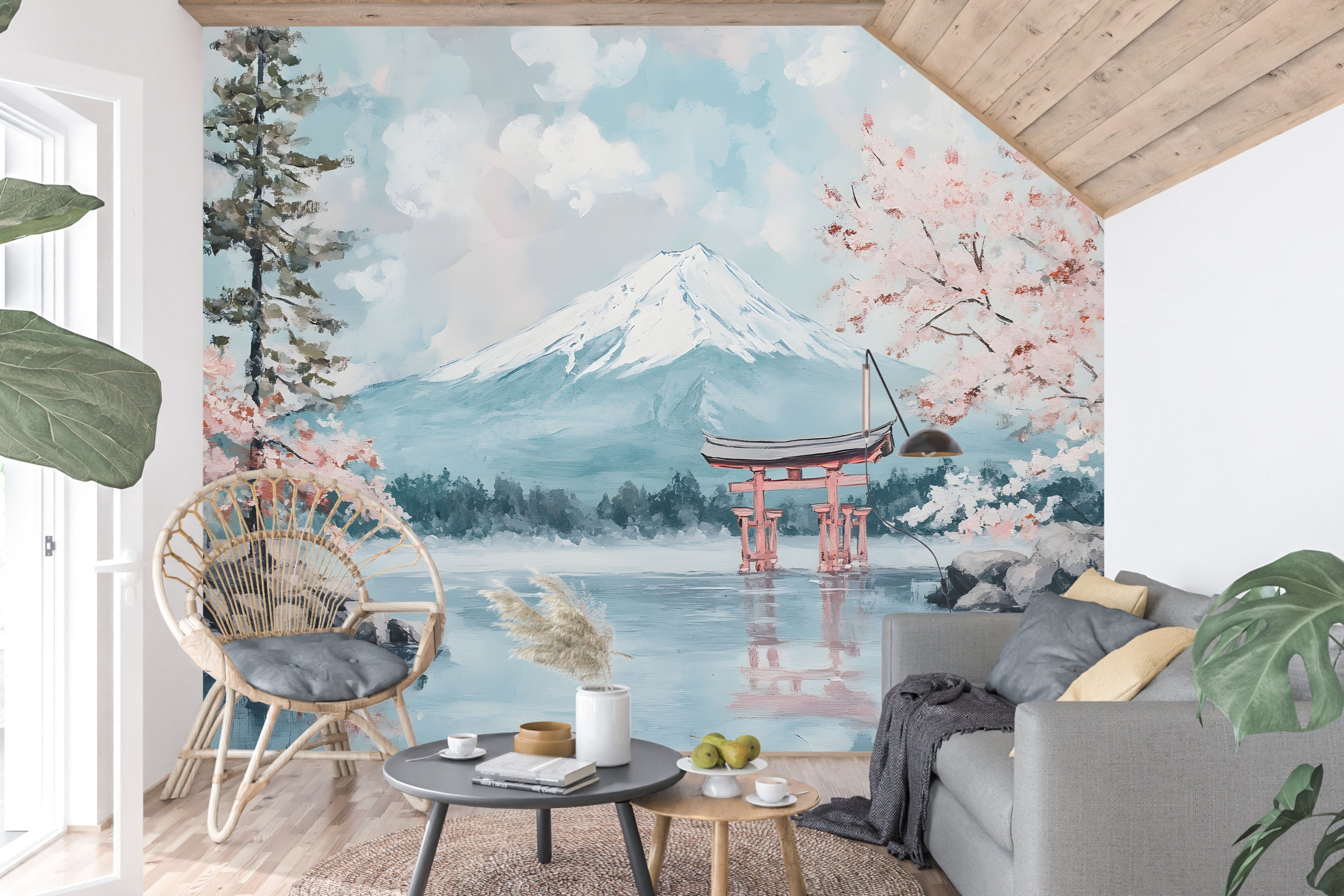 A wide shot of a serene living room with Japanese-inspired decor, highlighting soft cherry blossom wallpaper and natural wood accents.