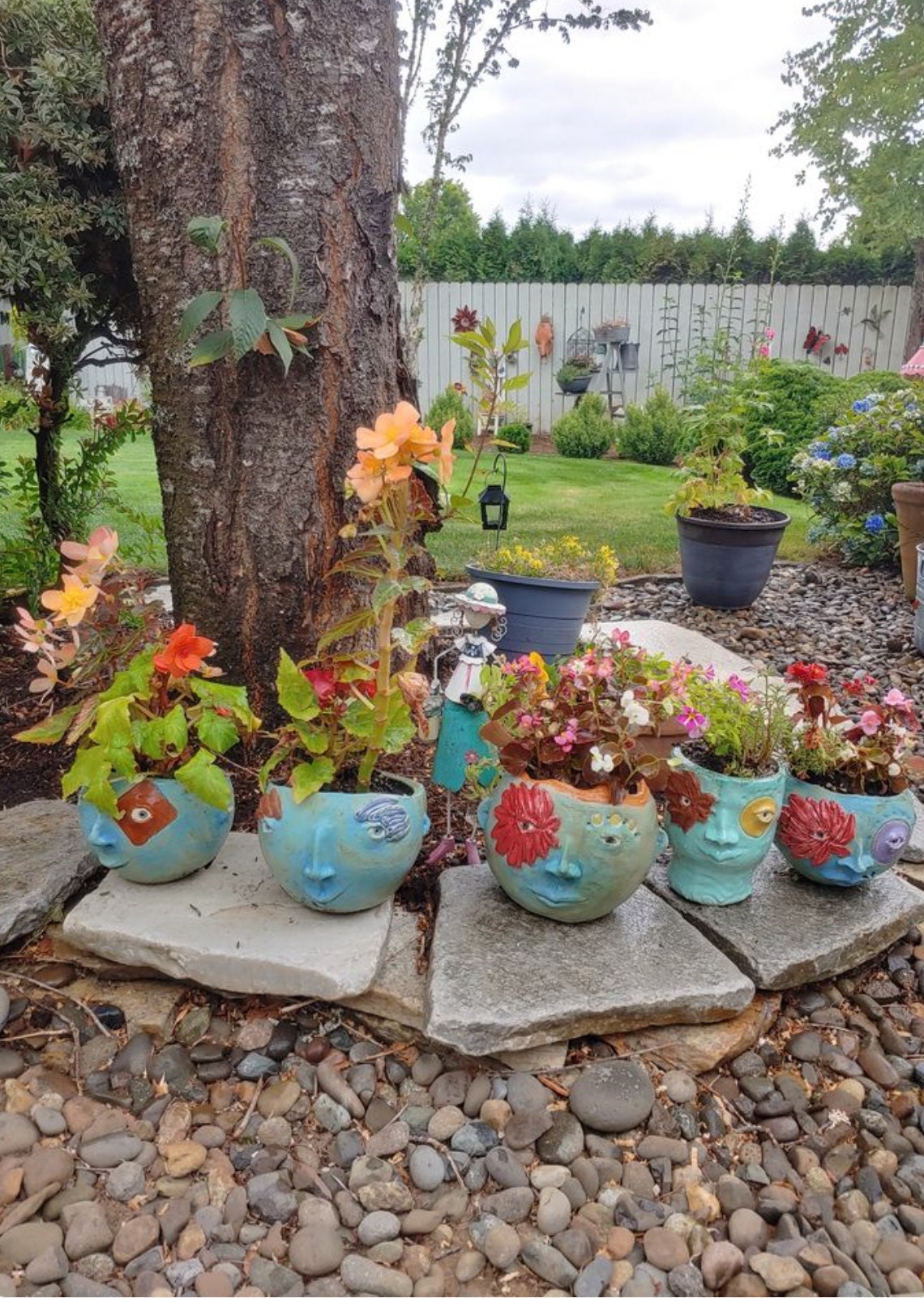 happy face planters with plants