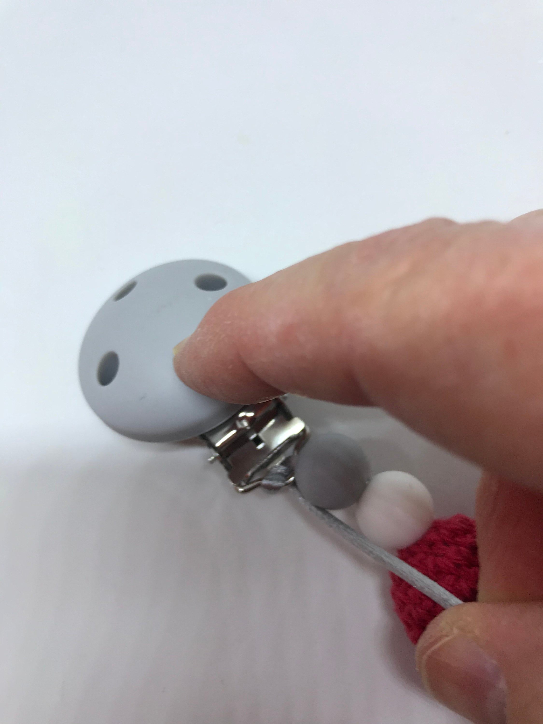 Pull the loop knot as tight as possible next to the beads.