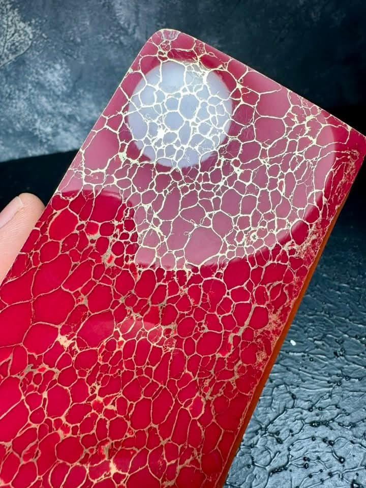 “Ruby red composite gemstone slab with golden neural veins by Mohit Impacts, polished fire-agate inspired material for premium crafting.”
