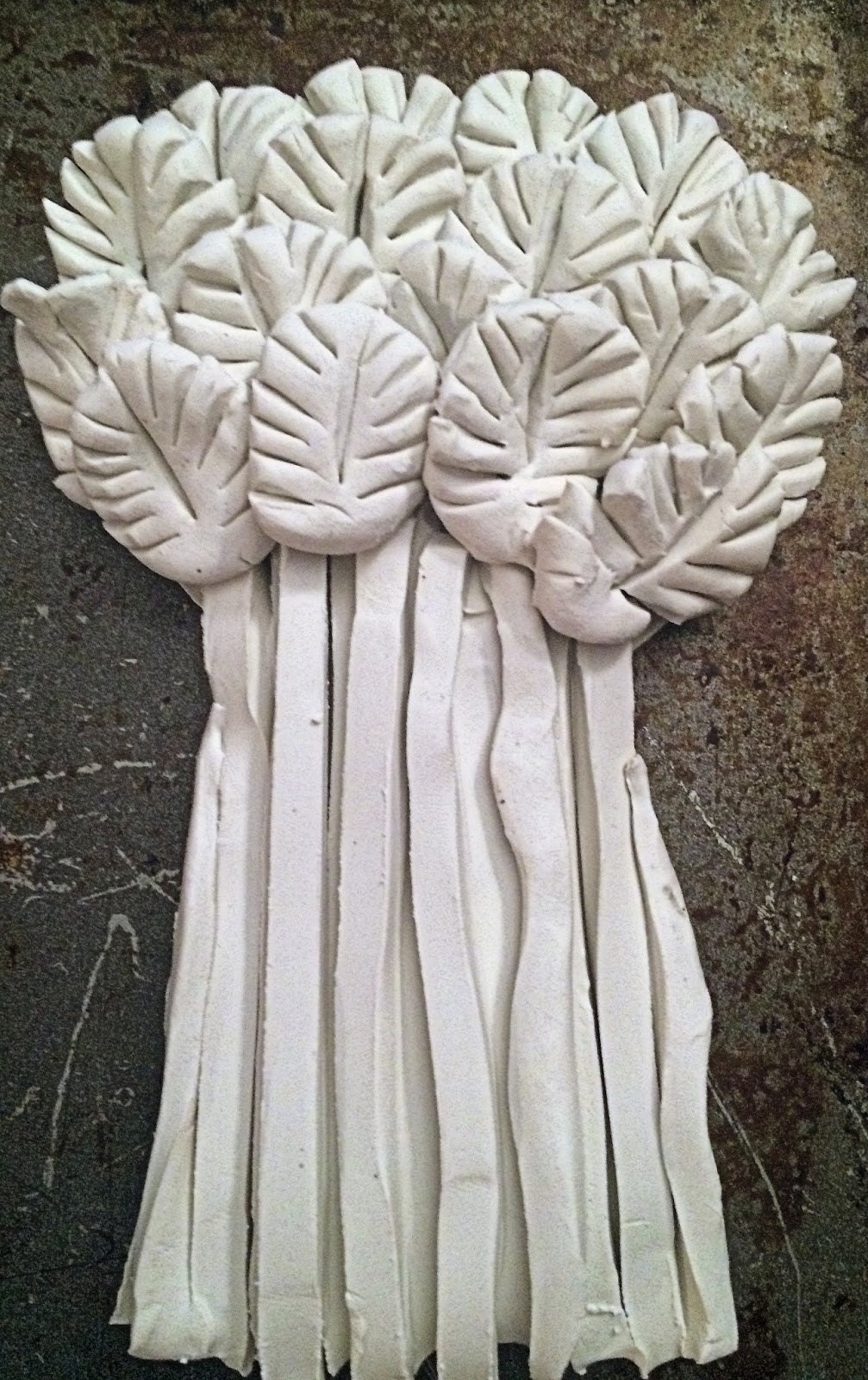 All wheat tops placed covering the strip ends on the base