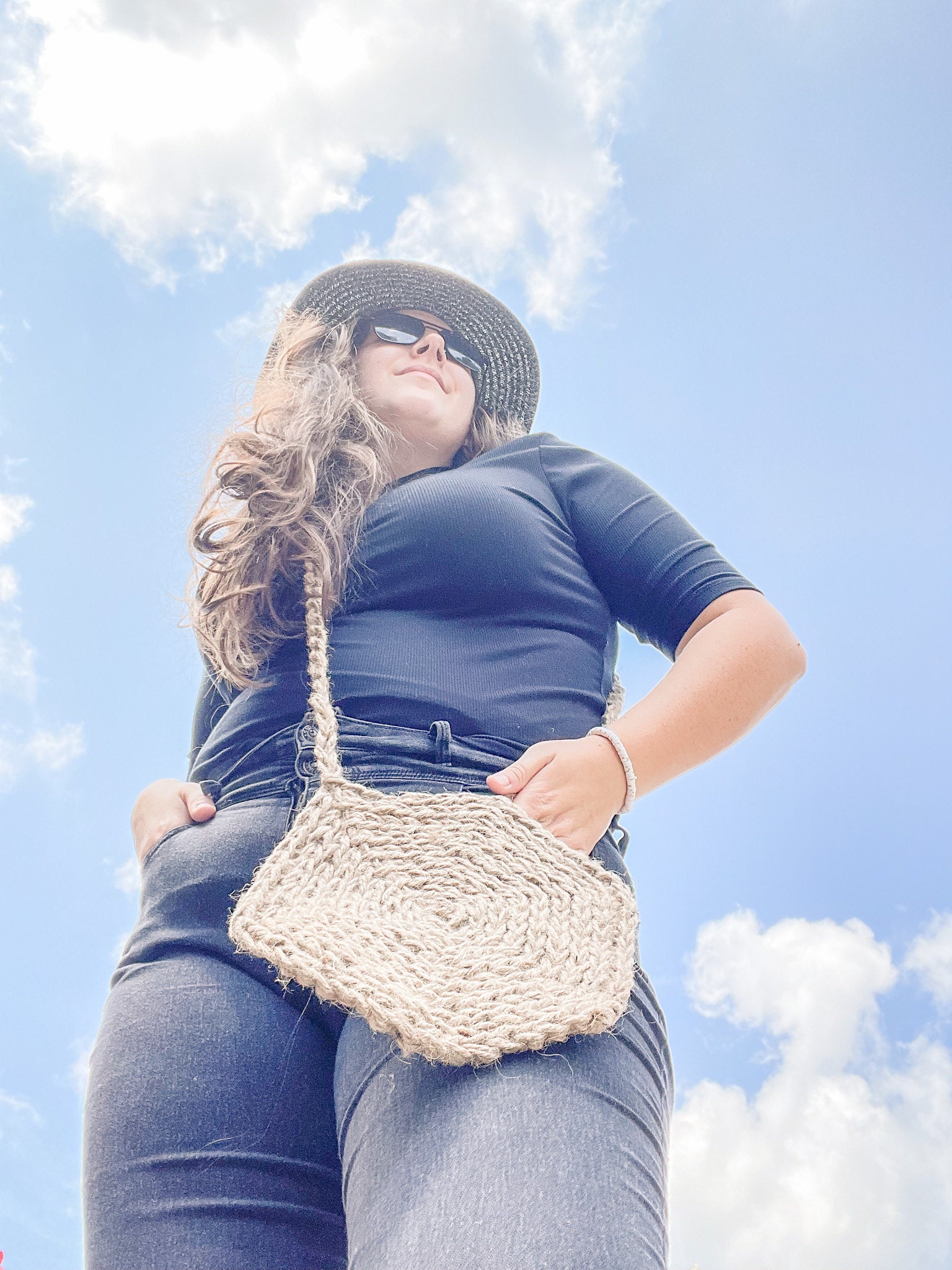 Woman wearing a natural crochet bag