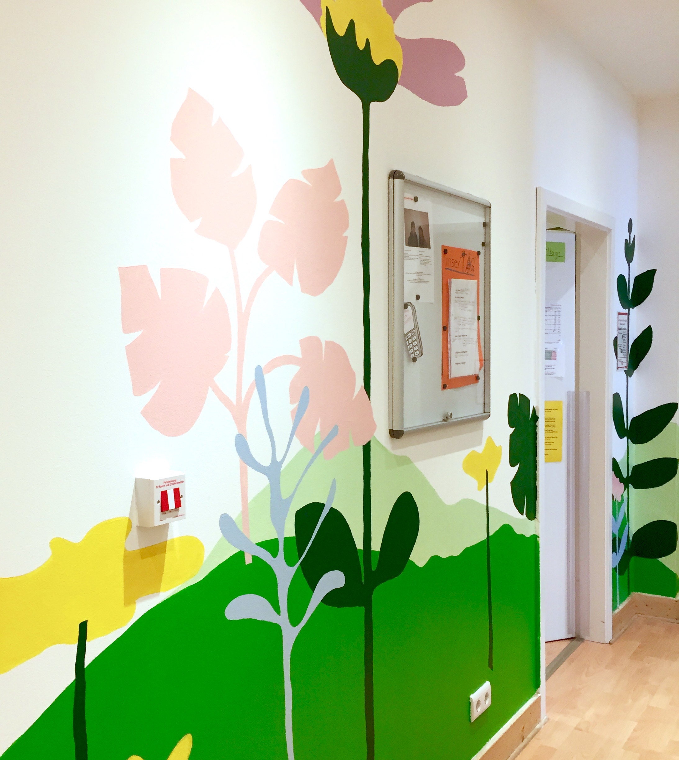 giant flower mural at a kindergarten by boatandballoon