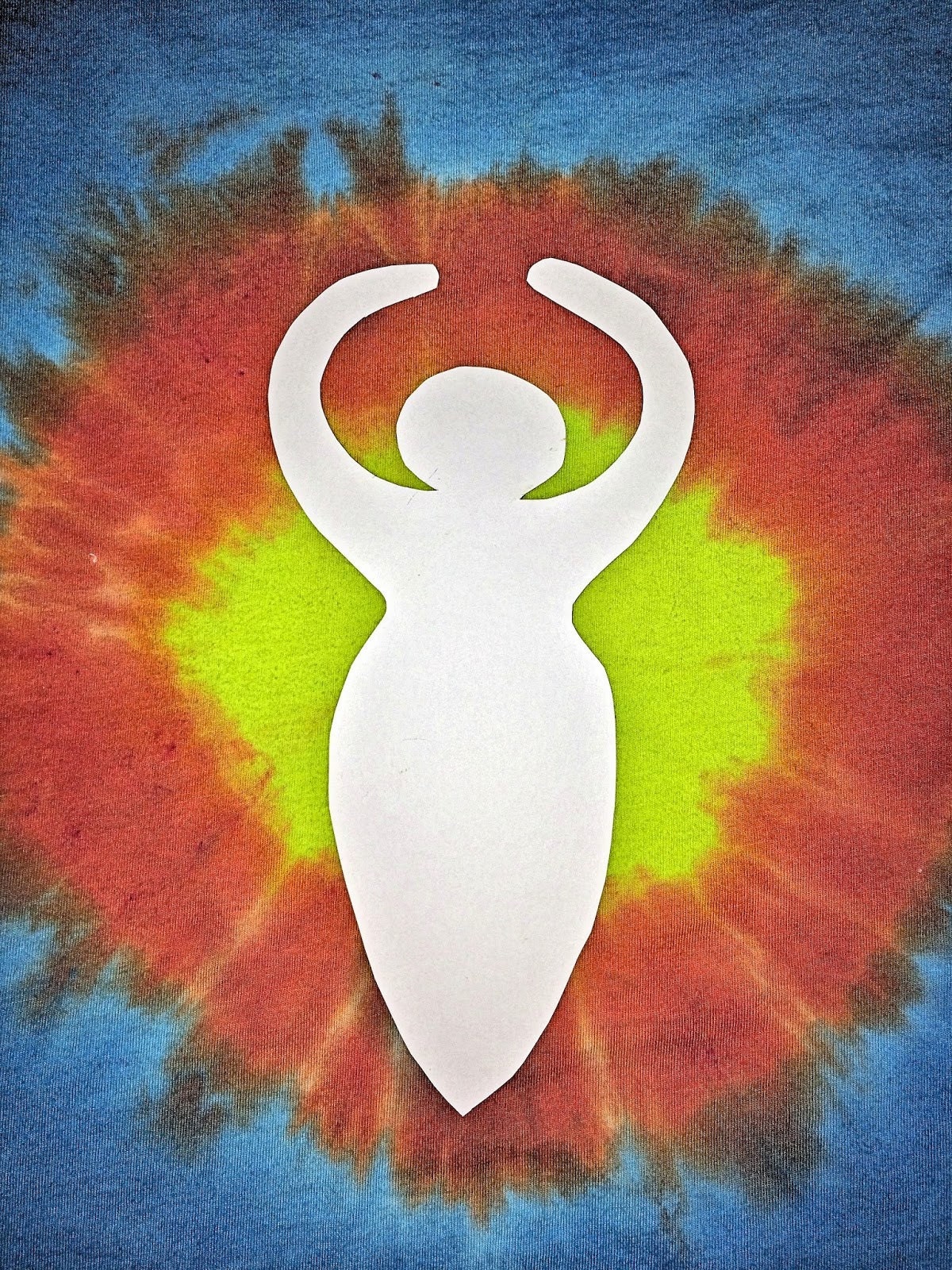 Cardstock goddess pattern cut out and centered on the sunburst shirt