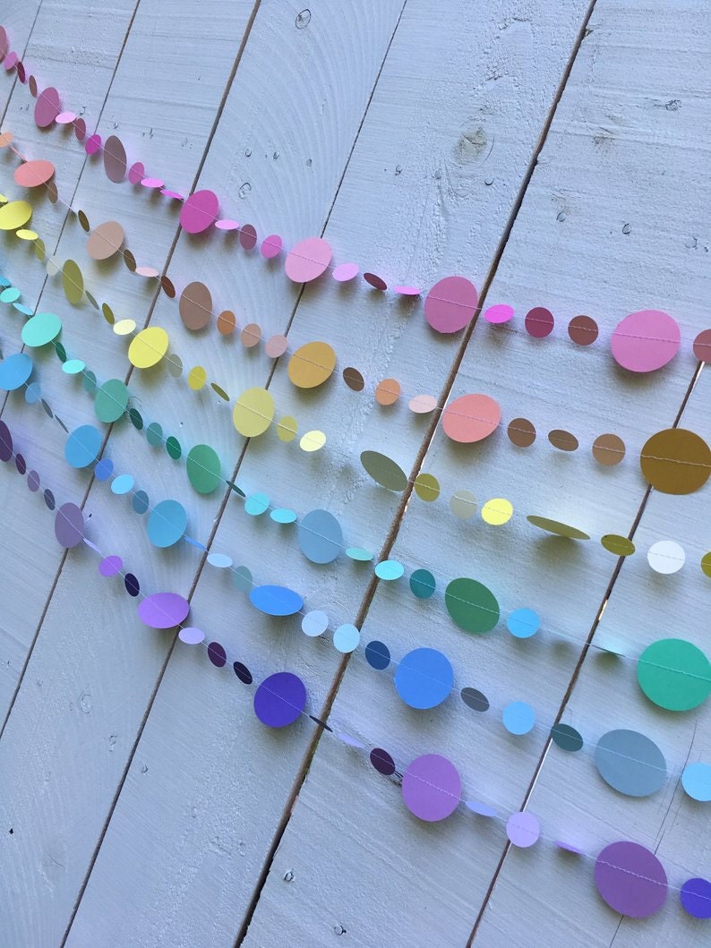 six strands of circle garlands in pink, peach, pale yellow, mint green, light blue, and lavender