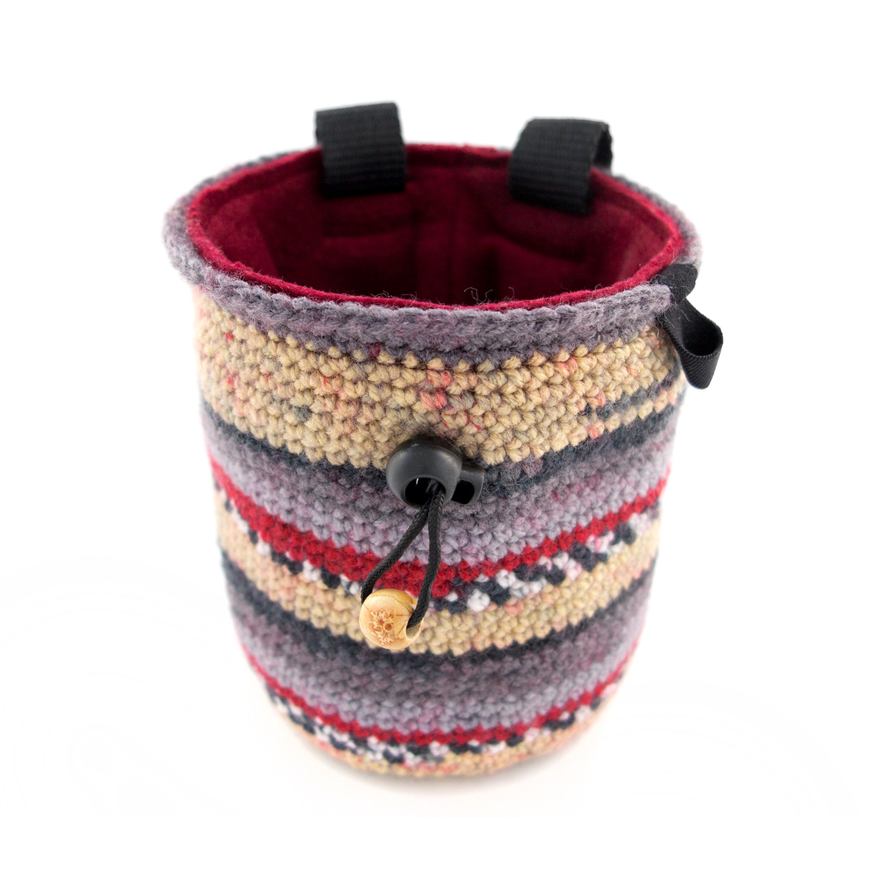 Nadamlada striped handmade chalk bag in L size, shown with wide open top designed for easy access during rock climbing sessions.
