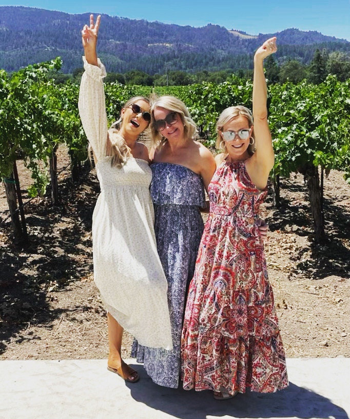 3 girls in a vineyard wearing summer maxi dresses
