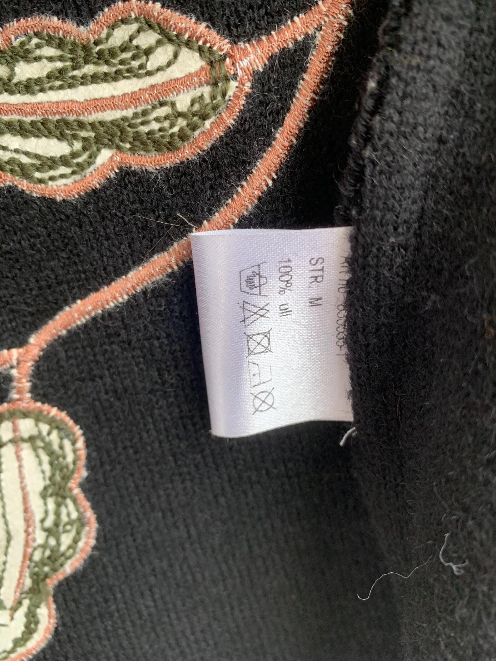 label of 100% wool cardigan