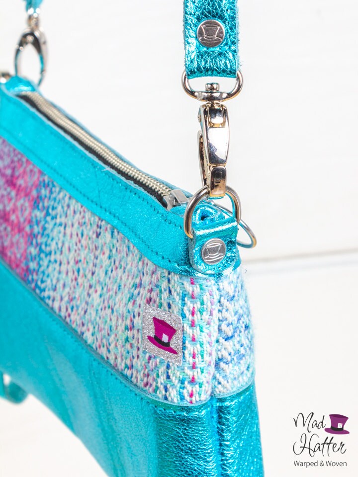 Mad Hatter Warped & Woven Hartley handbag featuring Remix colourway and teal metallic leather.